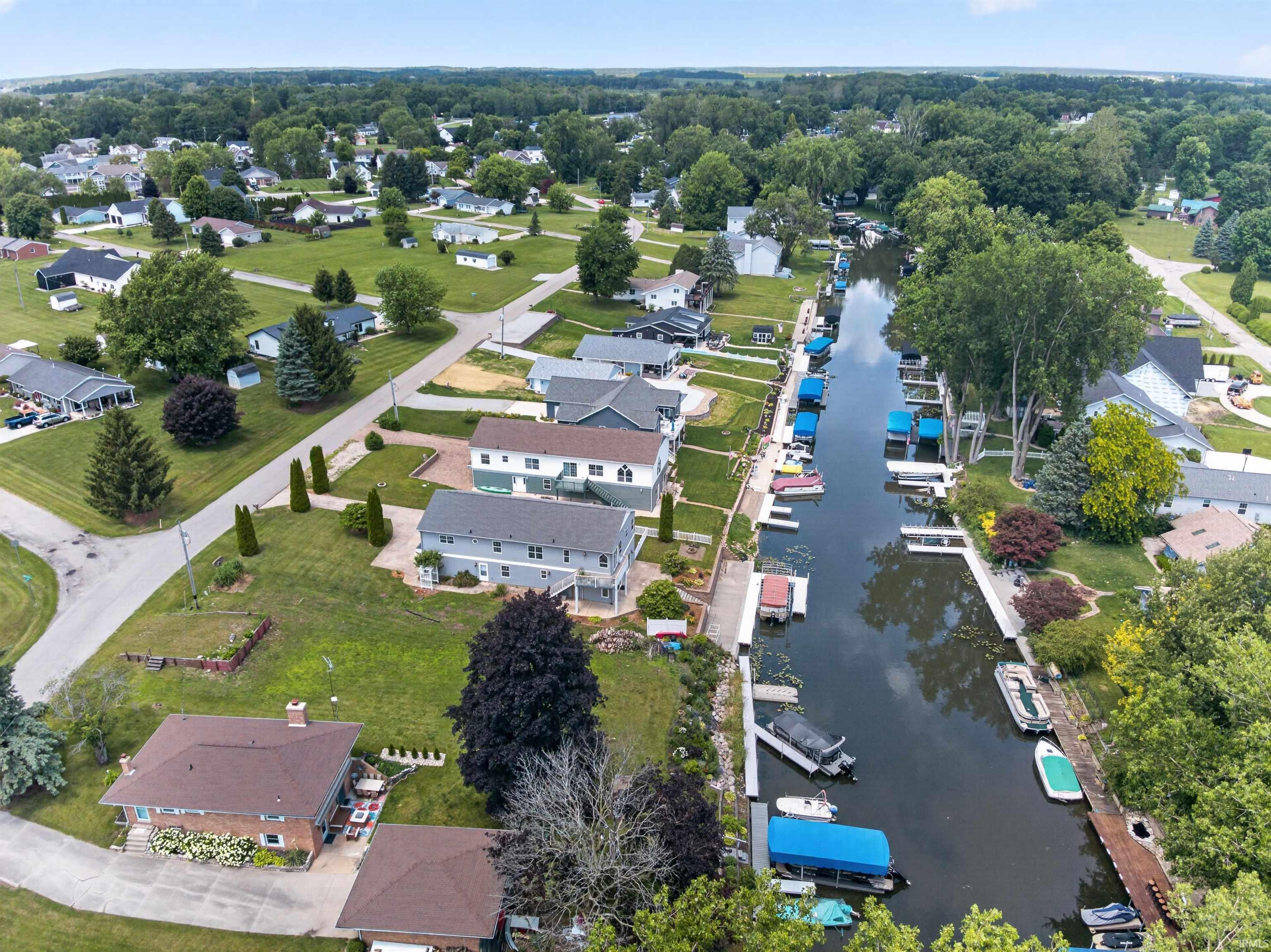 Canal-front property featuring extensive private boat docks and covered boat lifts