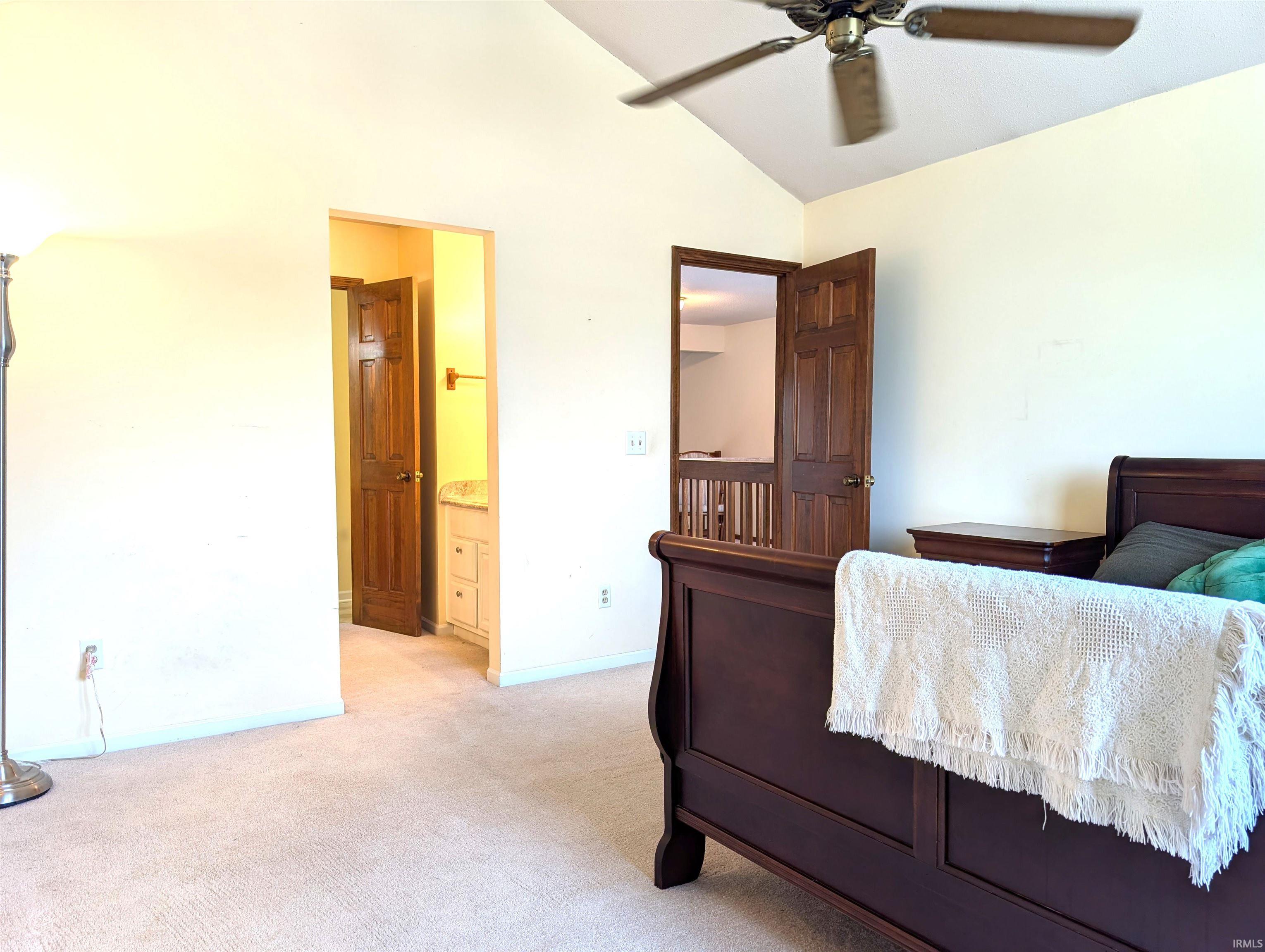 Vaulted ceiling with a brushed nickel ceiling fan