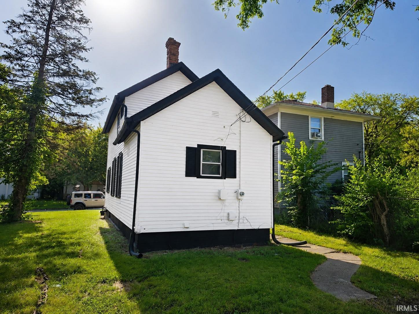 White siding exterior with contrasting black trim