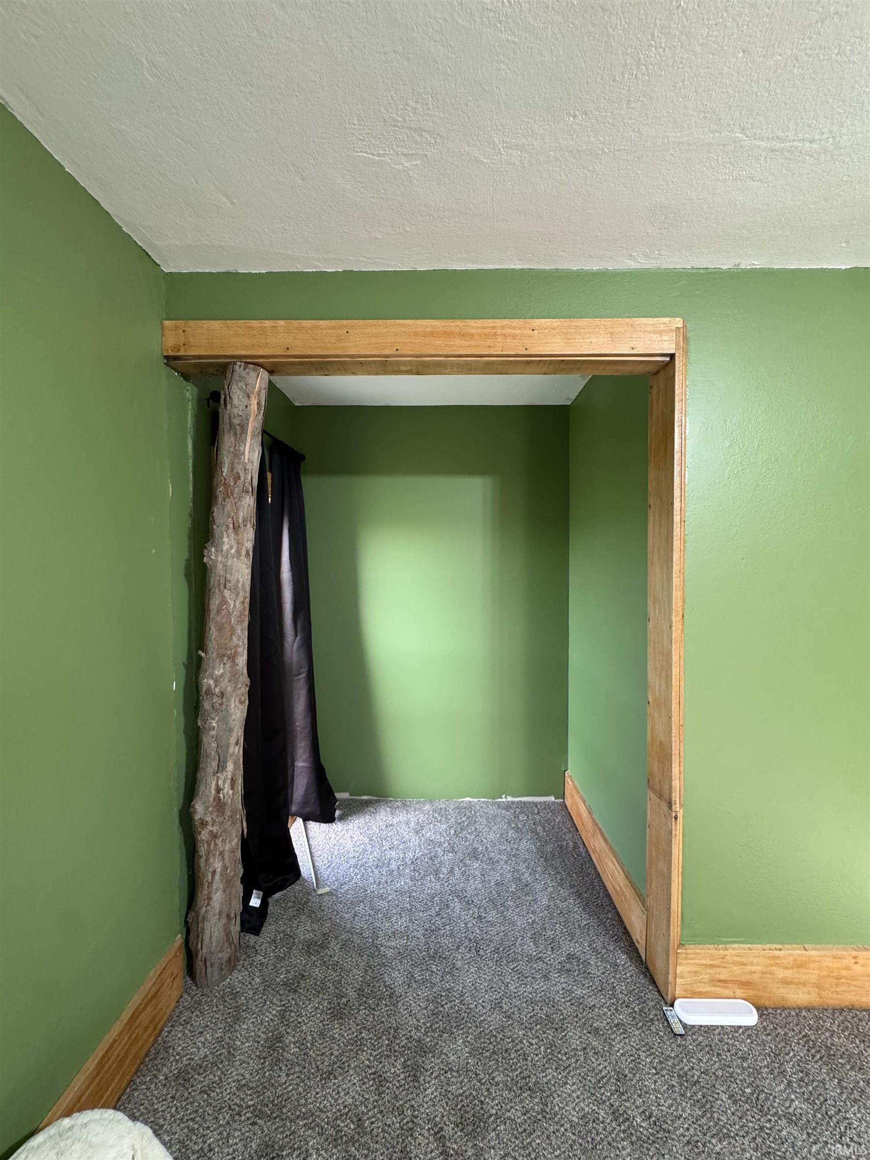 Green painted interior with textured ceiling