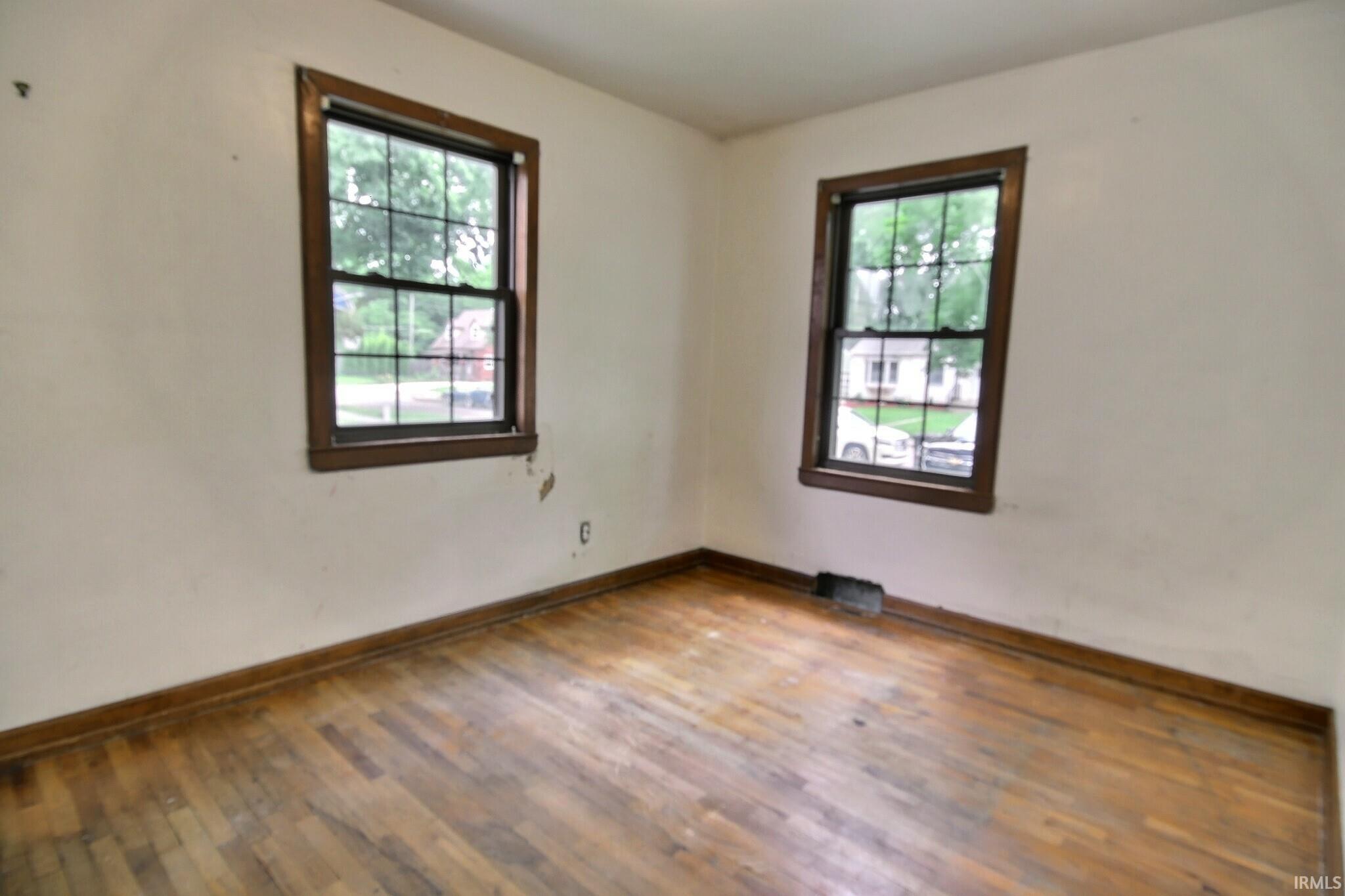 Wood-finish flooring with baseboard trim