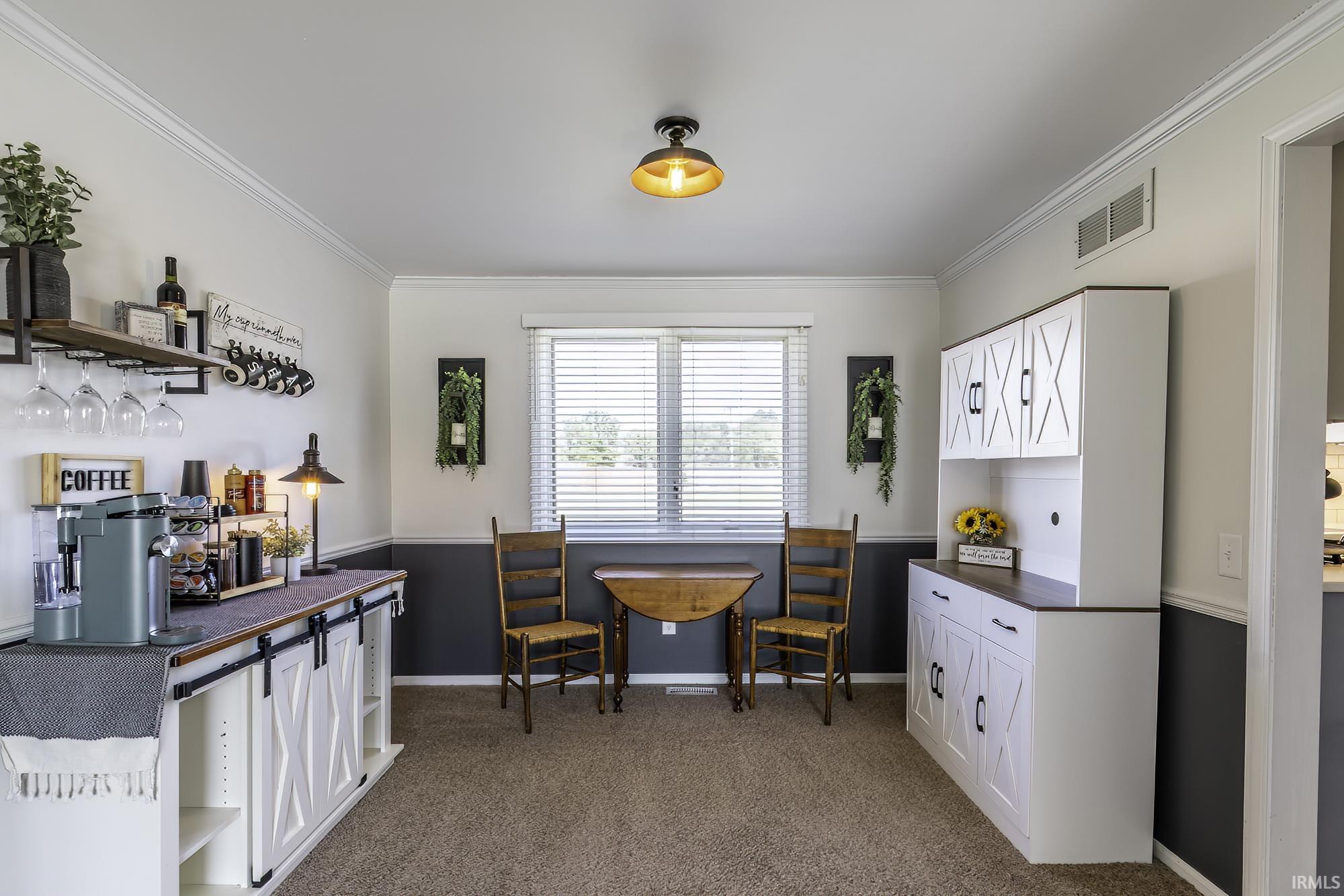 Dedicated beverage bar with integrated shelving and glass rack