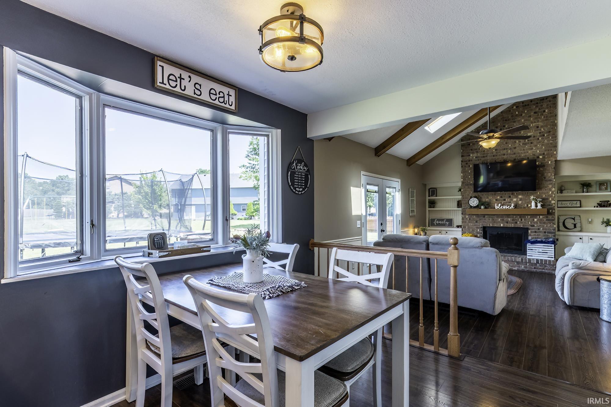 Dining area with bay windows overlooking the grounds