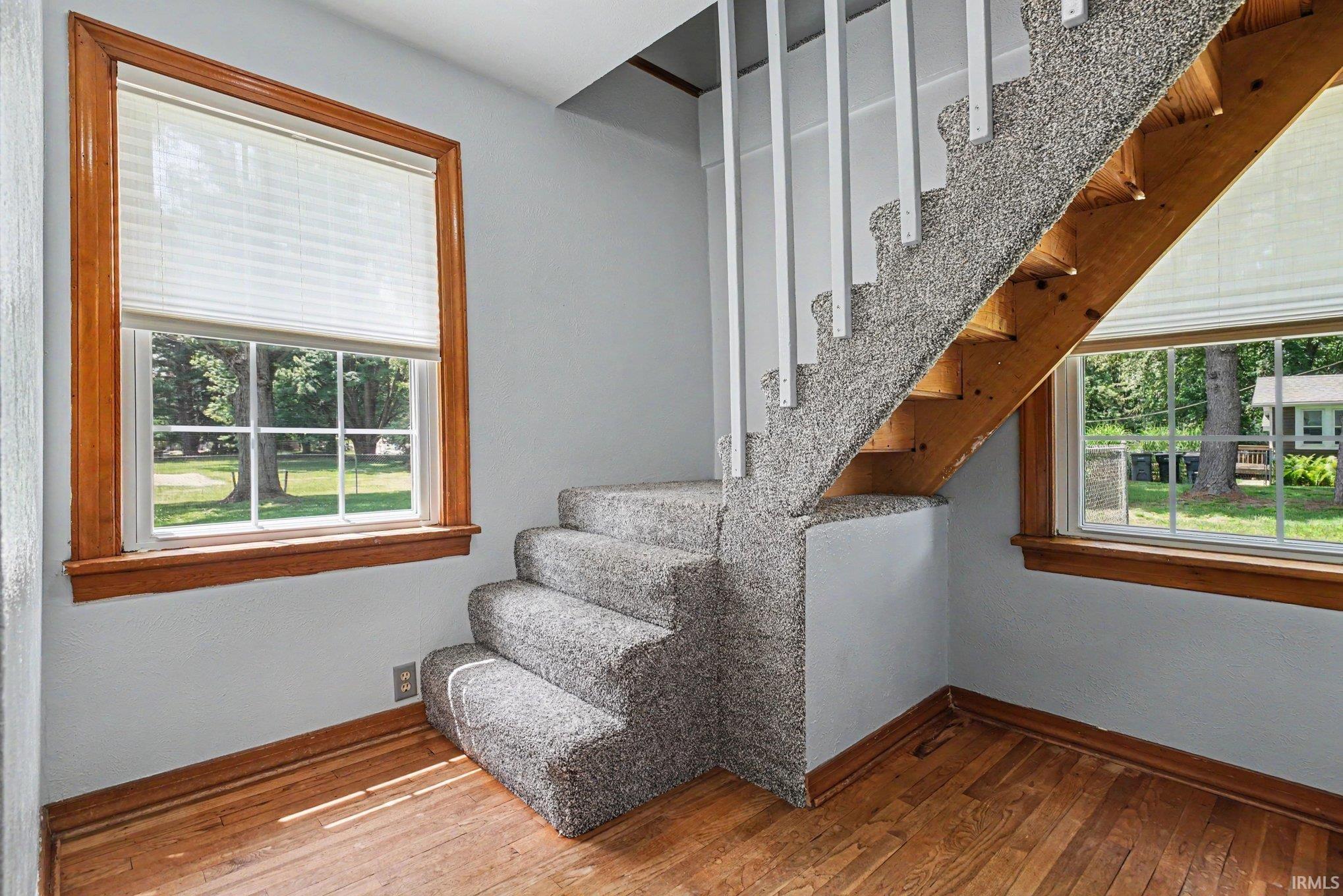 Den w/ Stairs to upper level