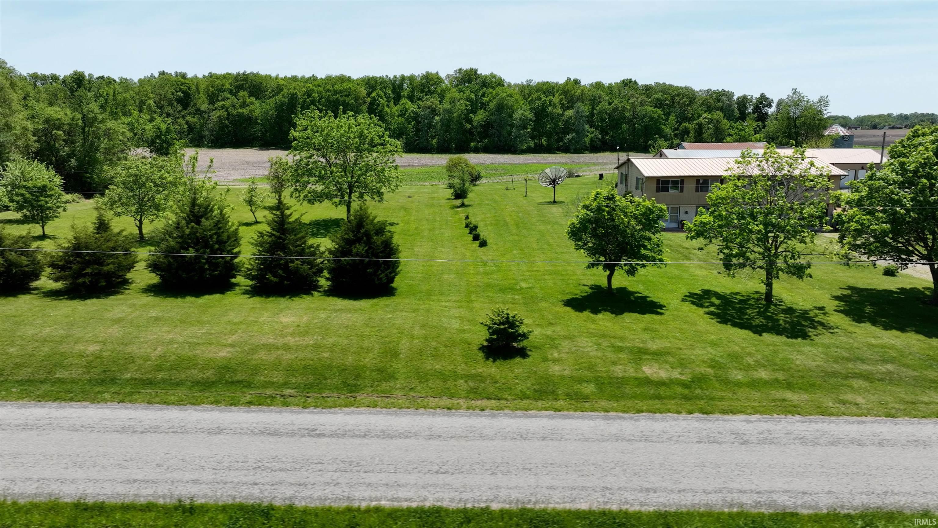 Spacious property featuring a two-story residence with a metal roof