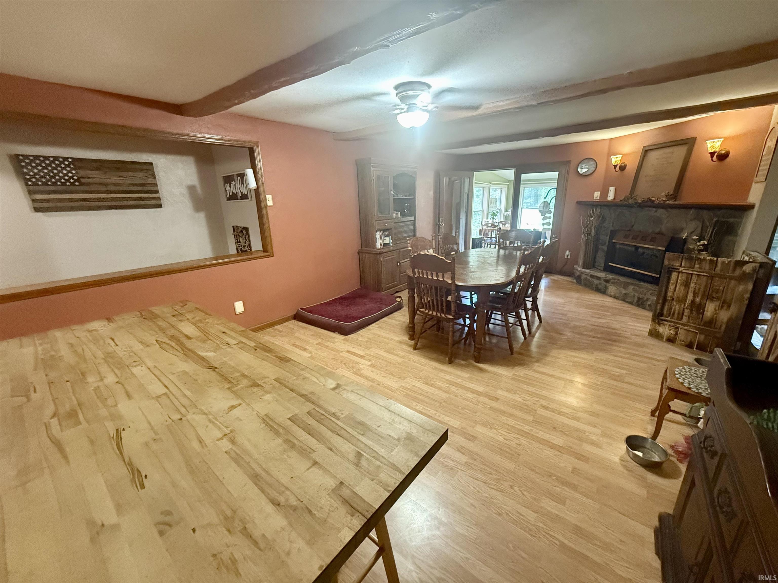 Kitchen island with wood-finish countertop and cabinetry