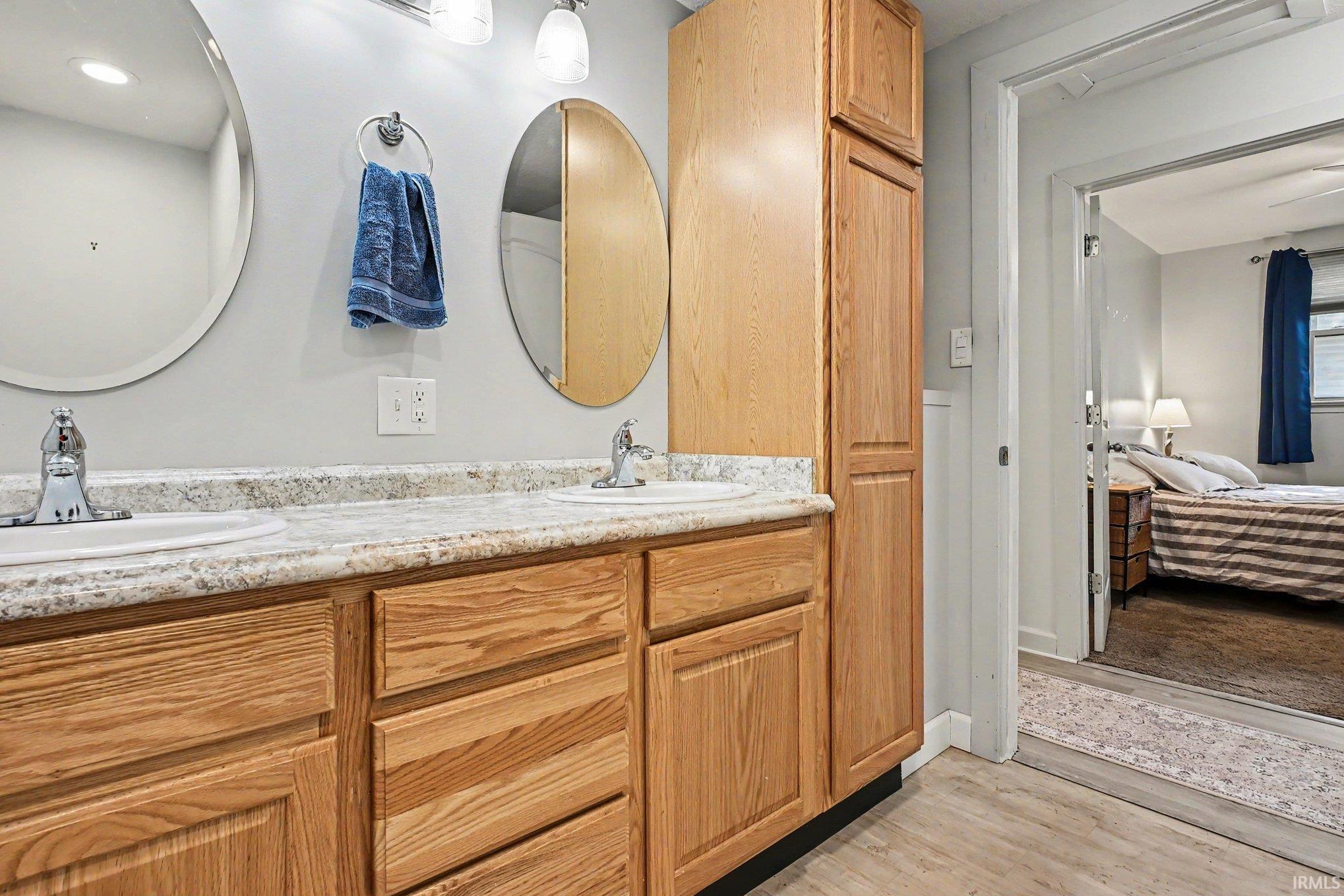 Dual vanity with integrated sinks and a speckled countertop