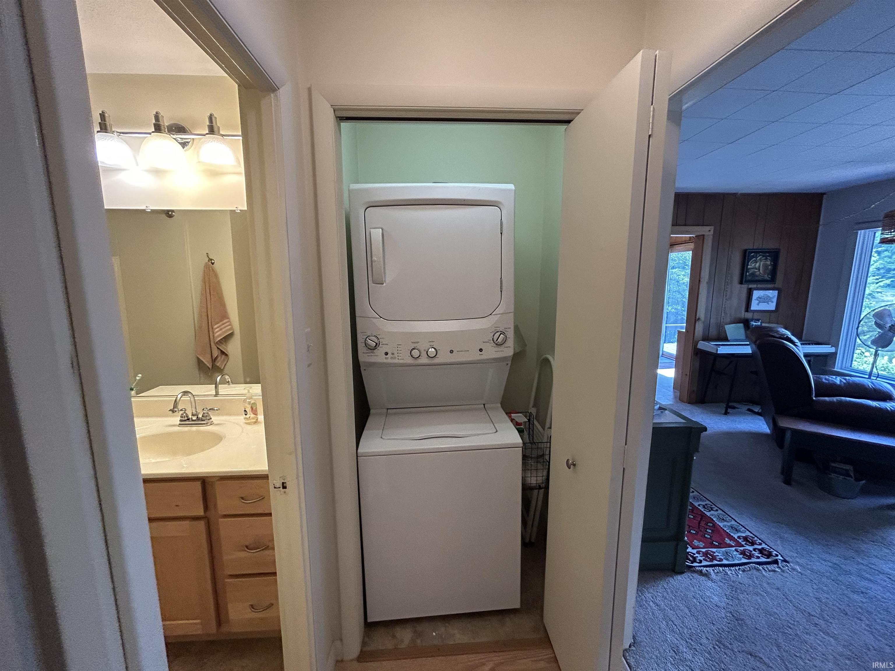 Vertical stackable laundry appliances within a dedicated closet
