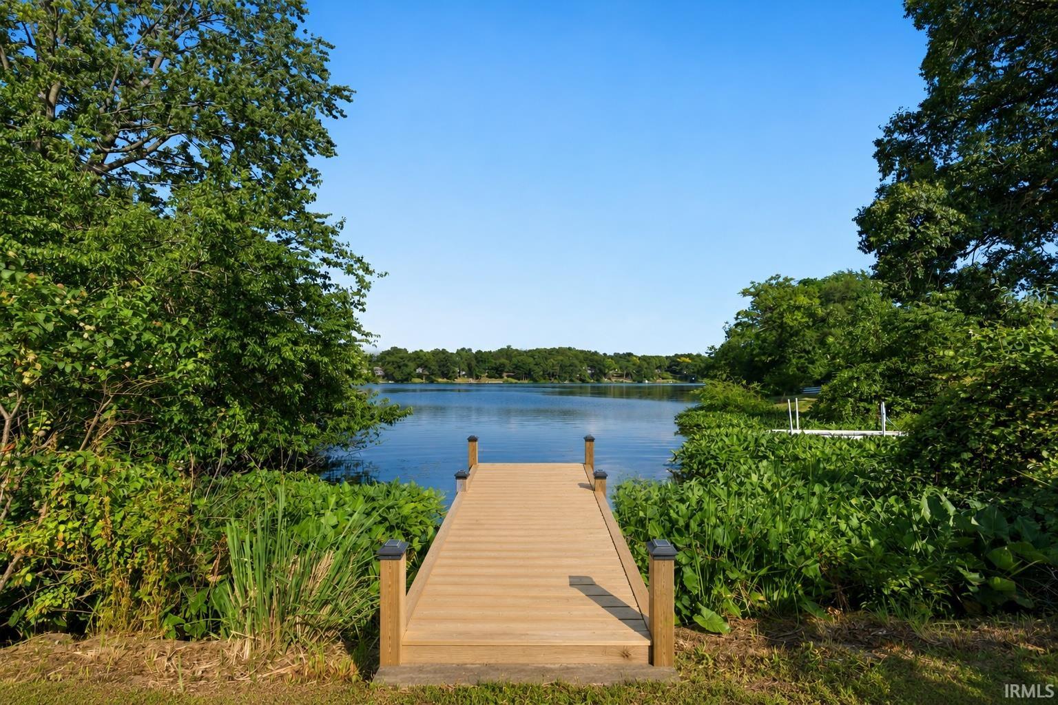 Wood-finish dock extending over calm waters
