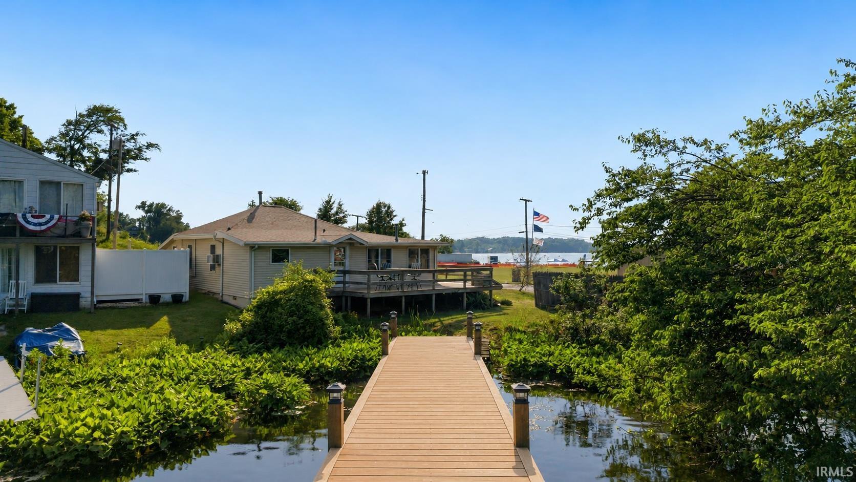Dock with composite decking, solar post lights, and tranquil water access