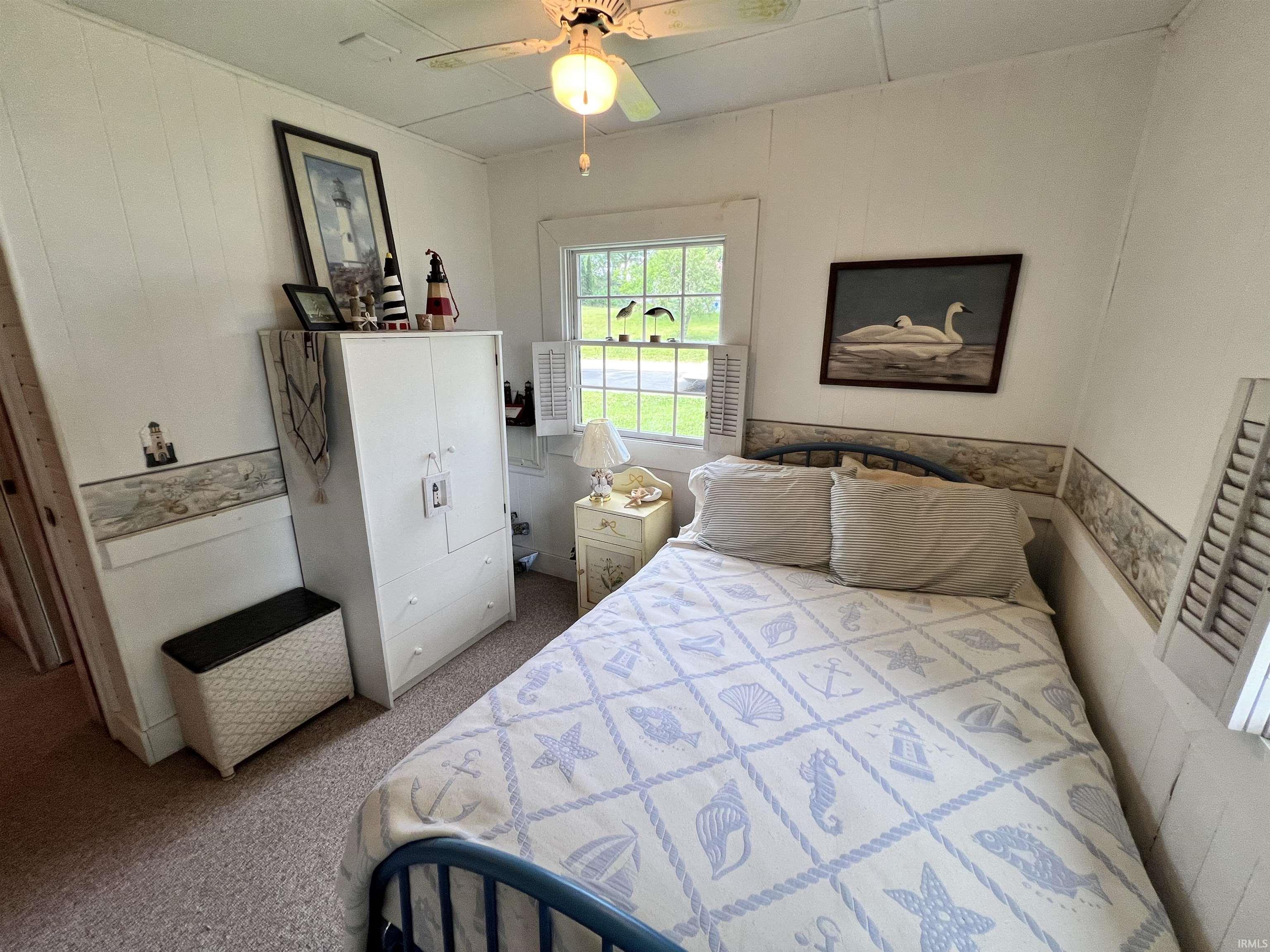 White paneled walls feature a decorative border