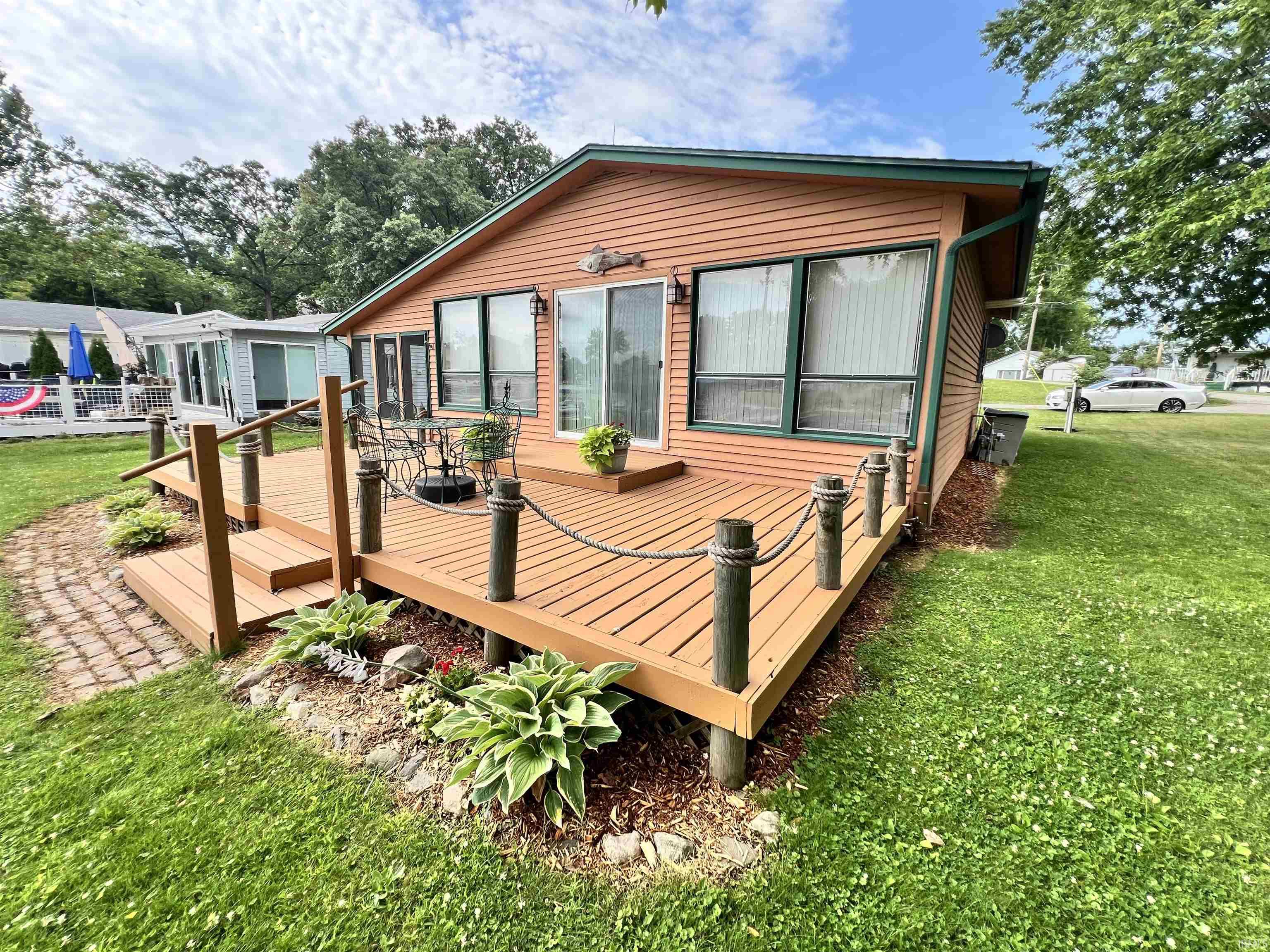Expansive wood deck with nautical-themed rope railings