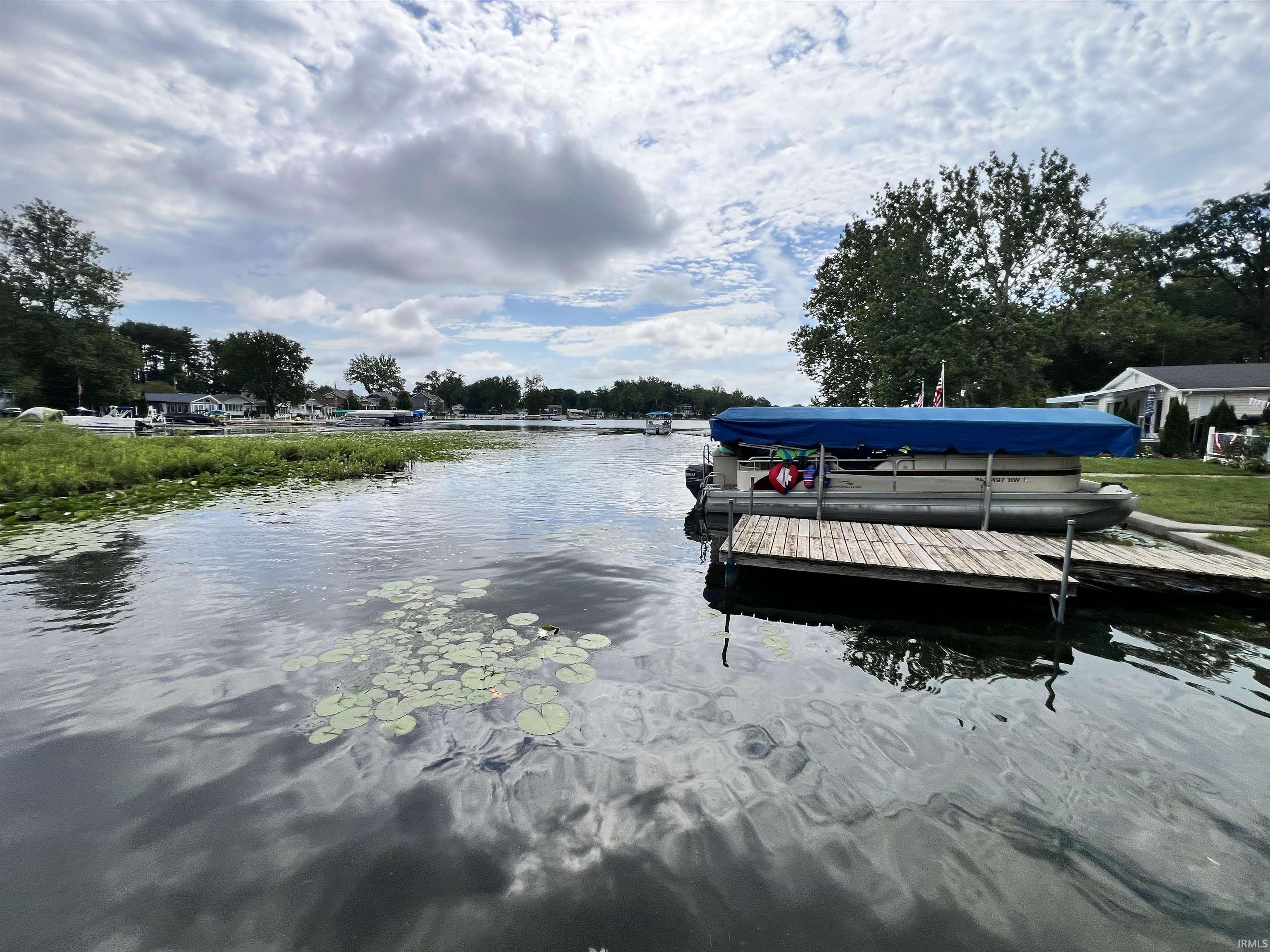 Waterfront property featuring a private wooden dock and direct lake access