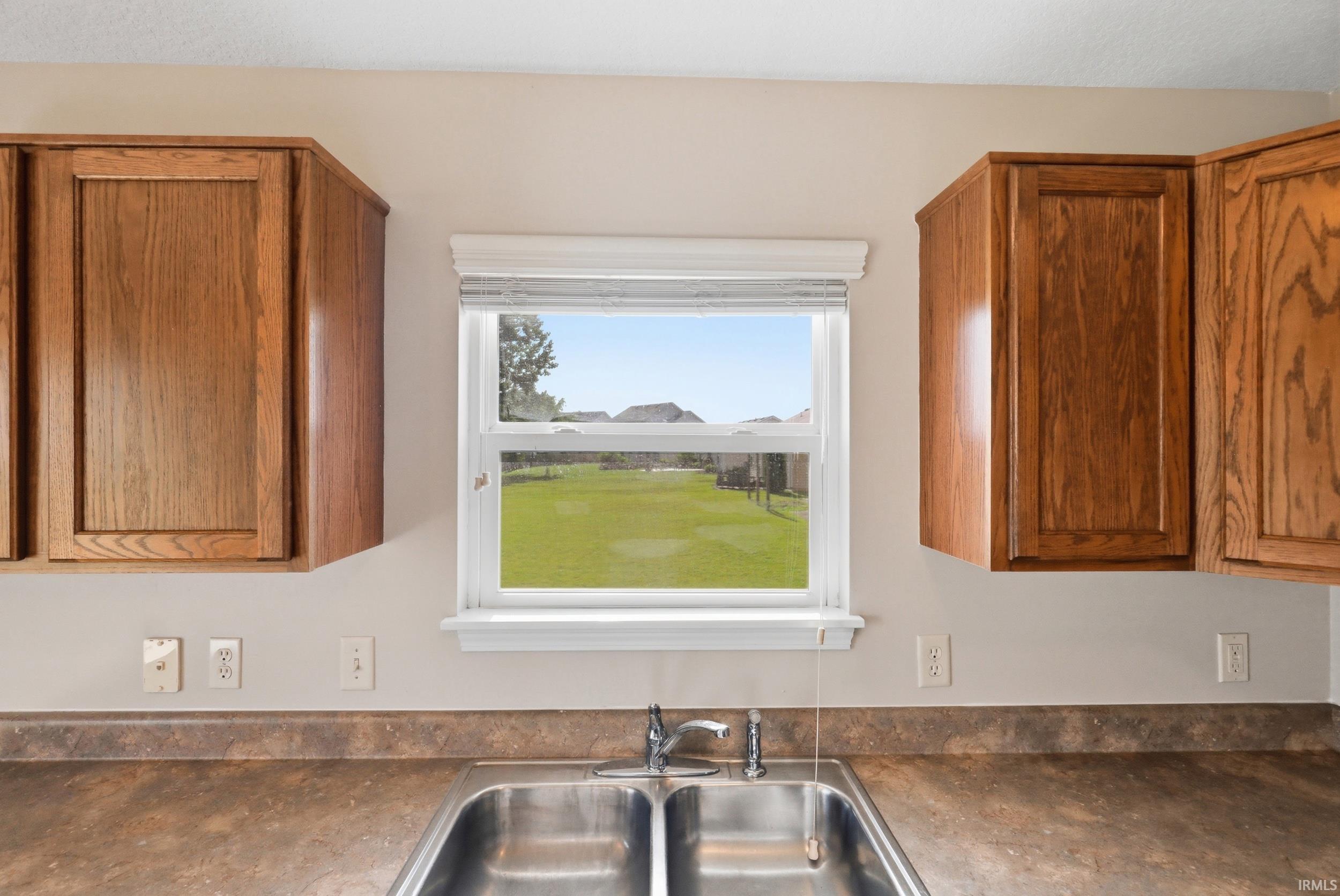 Double basin stainless steel sink with a chrome faucet