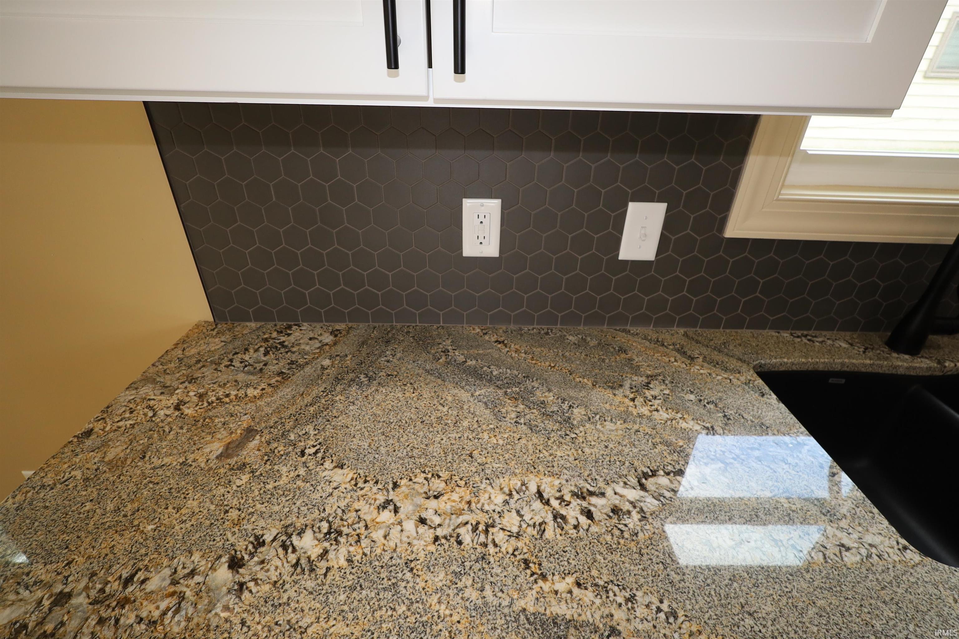 Polished granite countertop with natural stone variations