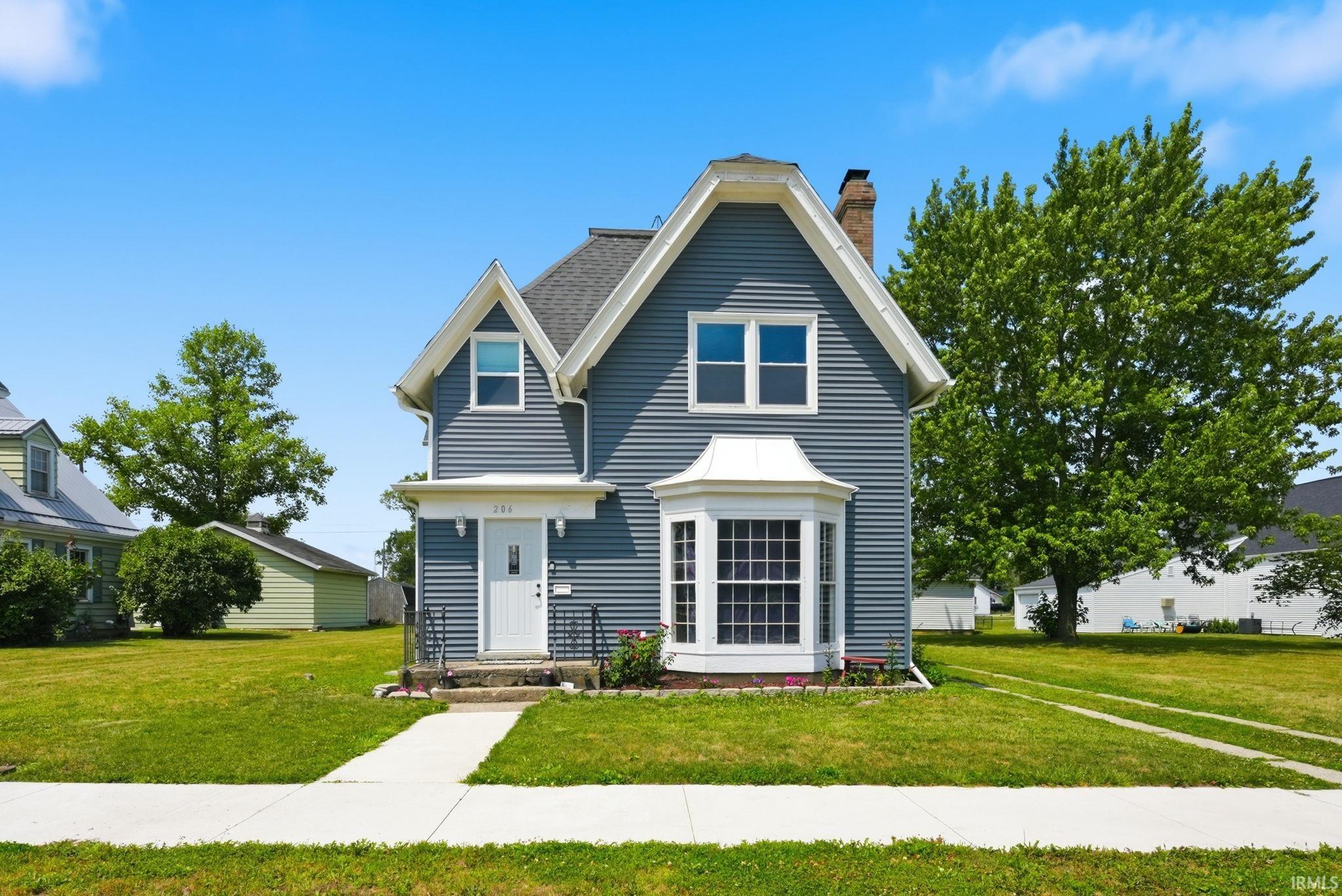 Great curb appeal two-story Tudor Style Residence with a prominent front bay window