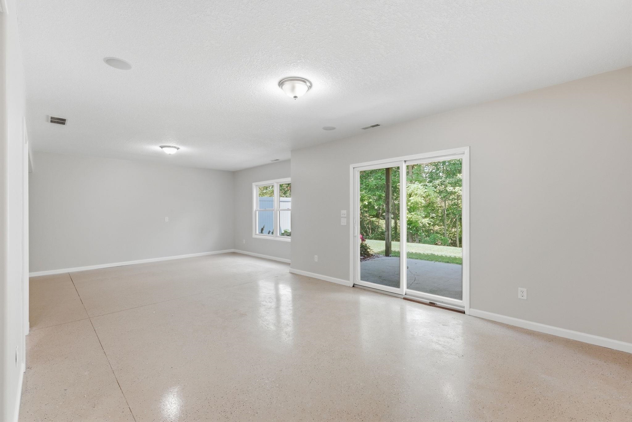 Spacious interior featuring light gray walls and light-colored flooring