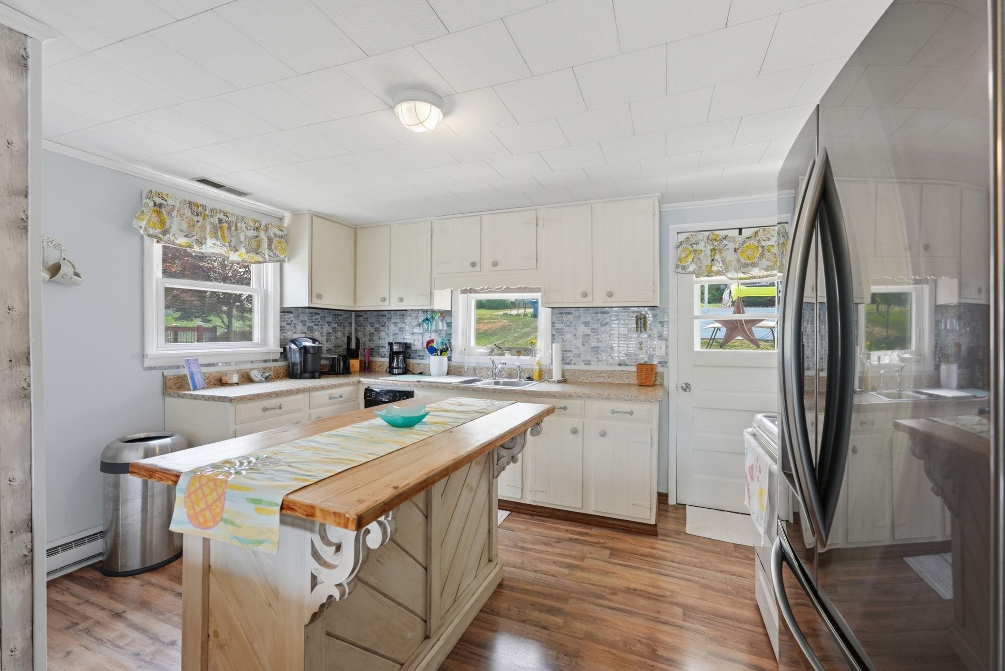 Open Kitchen to Dinette and Living area feature butcher block island