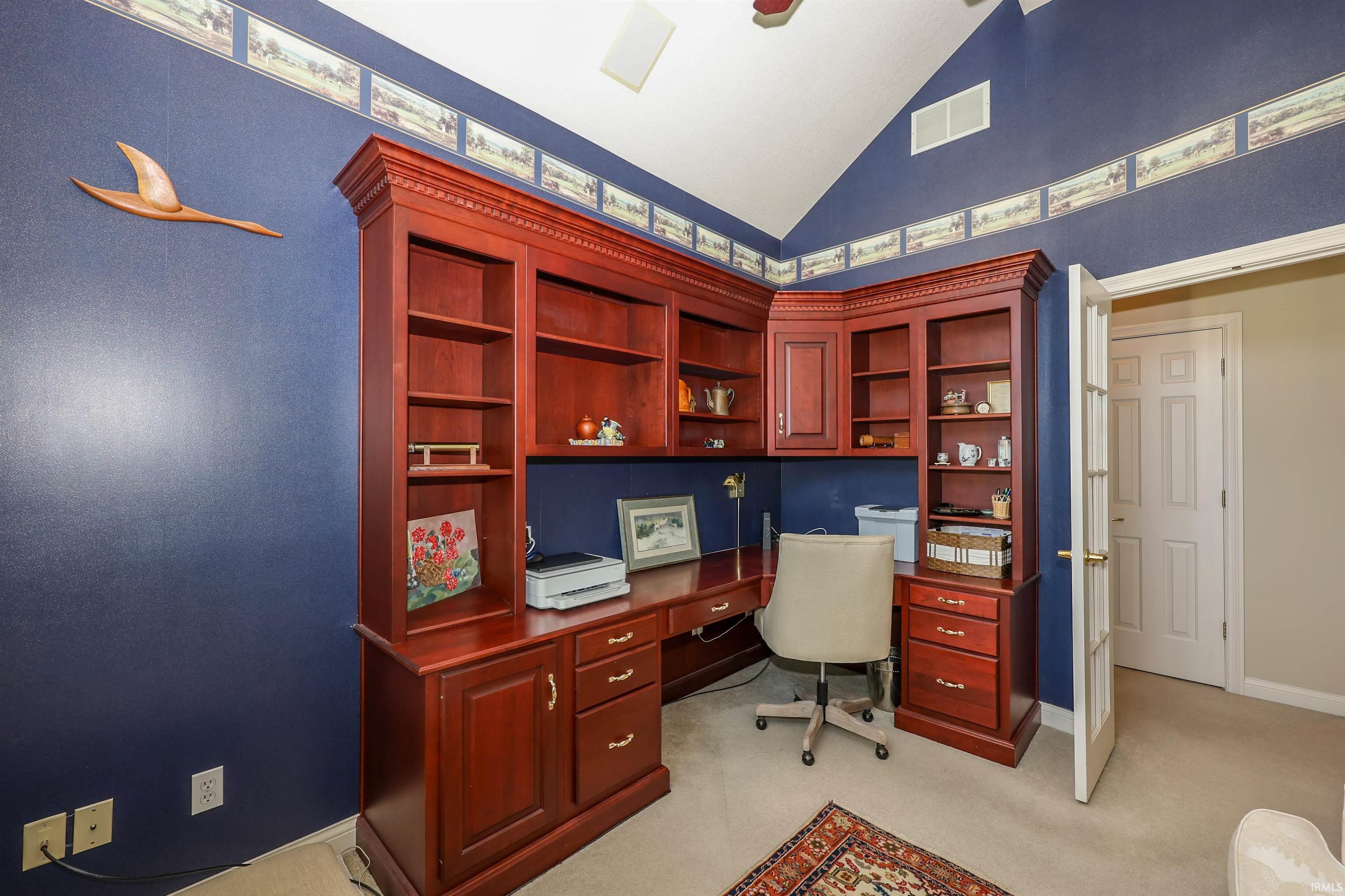 Custom built-in desk and cabinetry with a rich wood finish