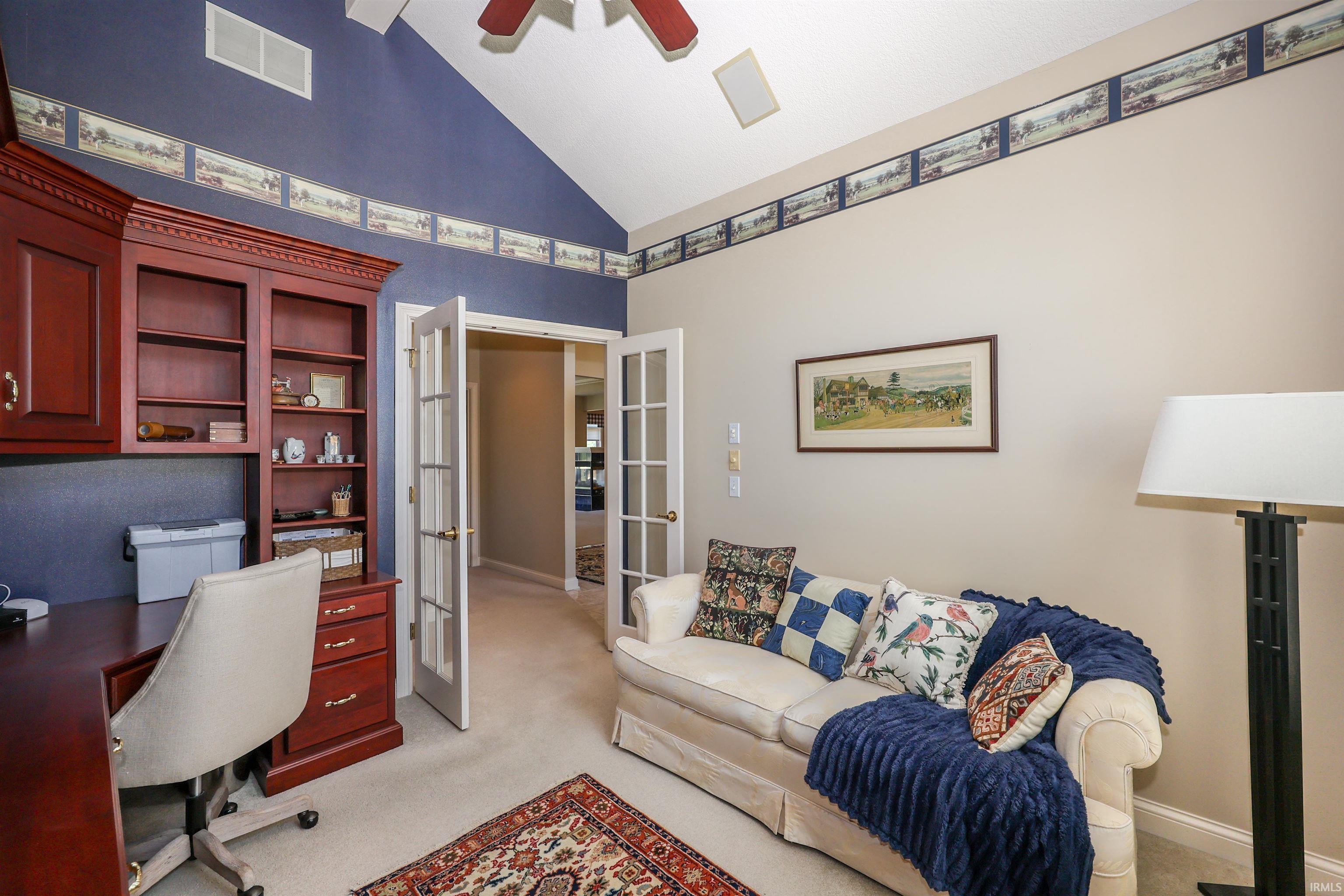 Room featuring vaulted ceilings and recessed lighting