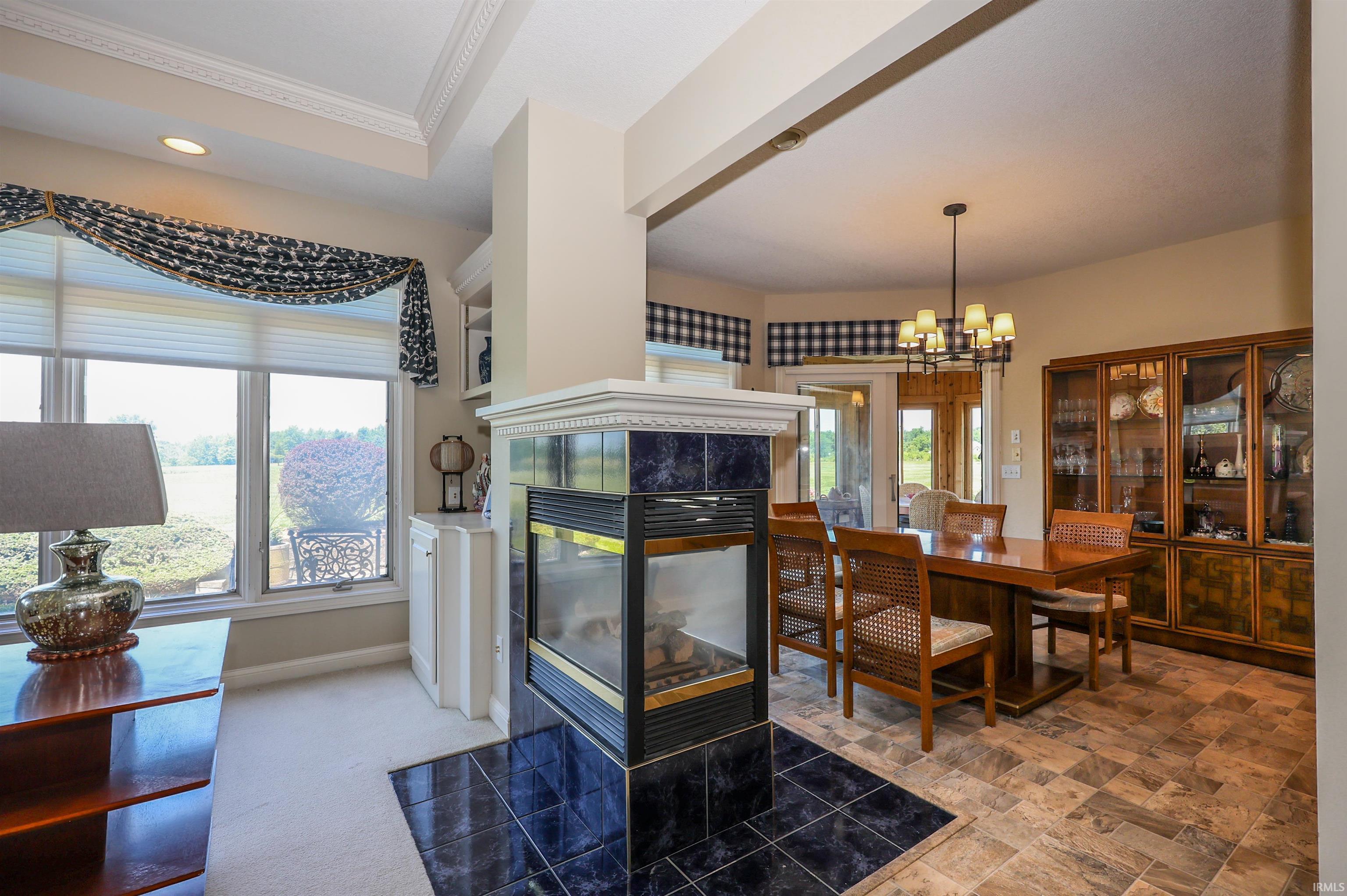 Central fireplace with dark tile surround and hearth