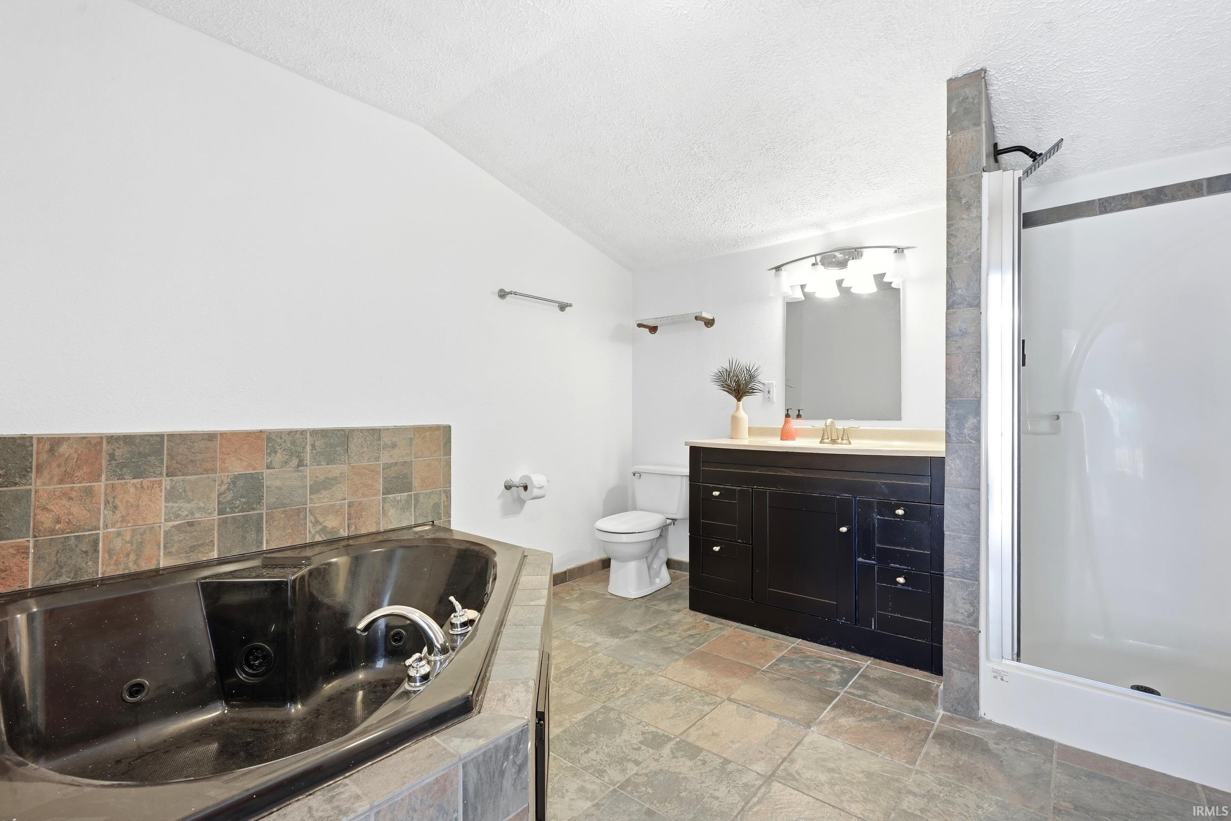 Corner soaker tub with tile surround