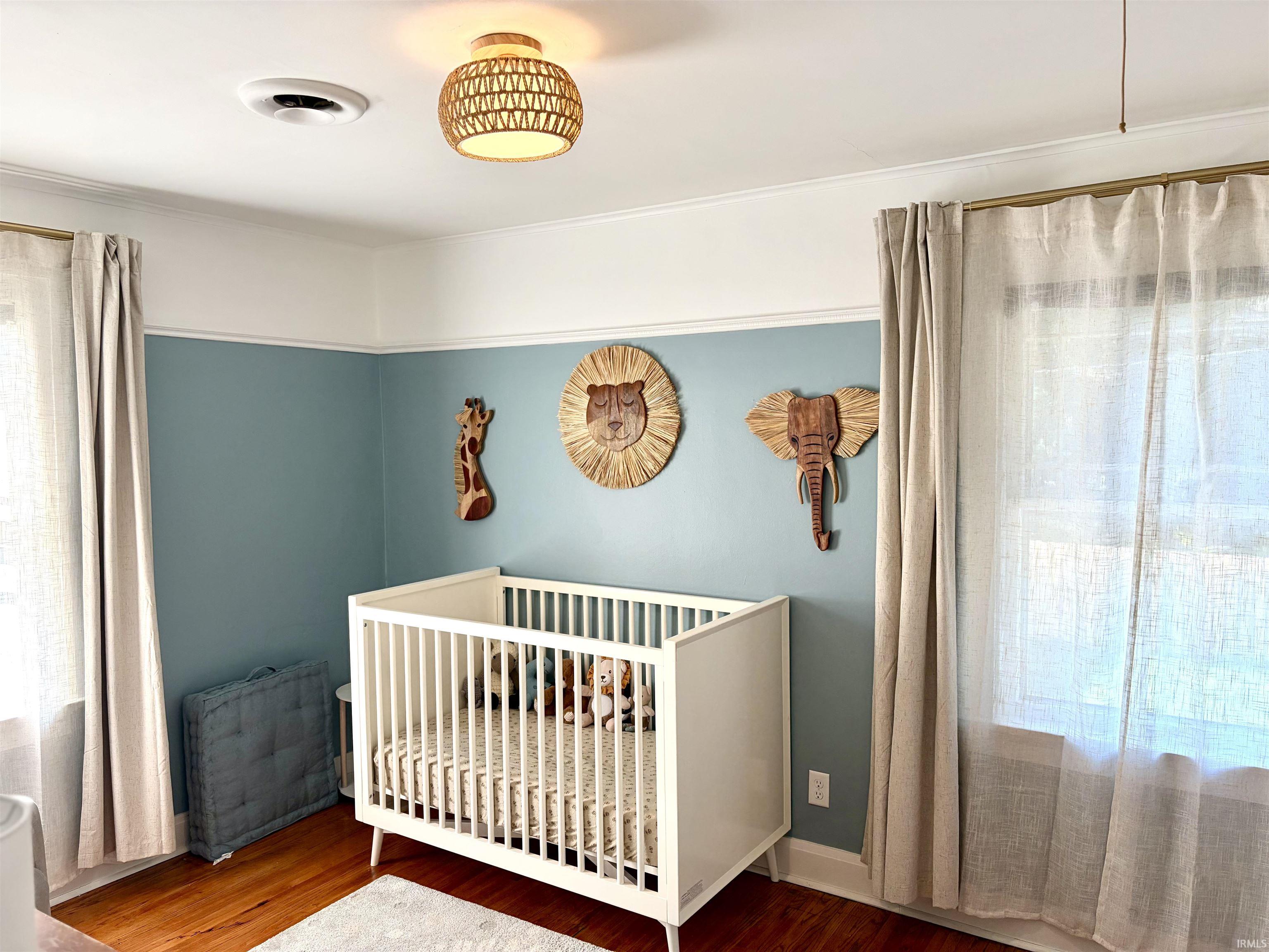 Room featuring a two-tone wall with a light blue lower section and white upper section