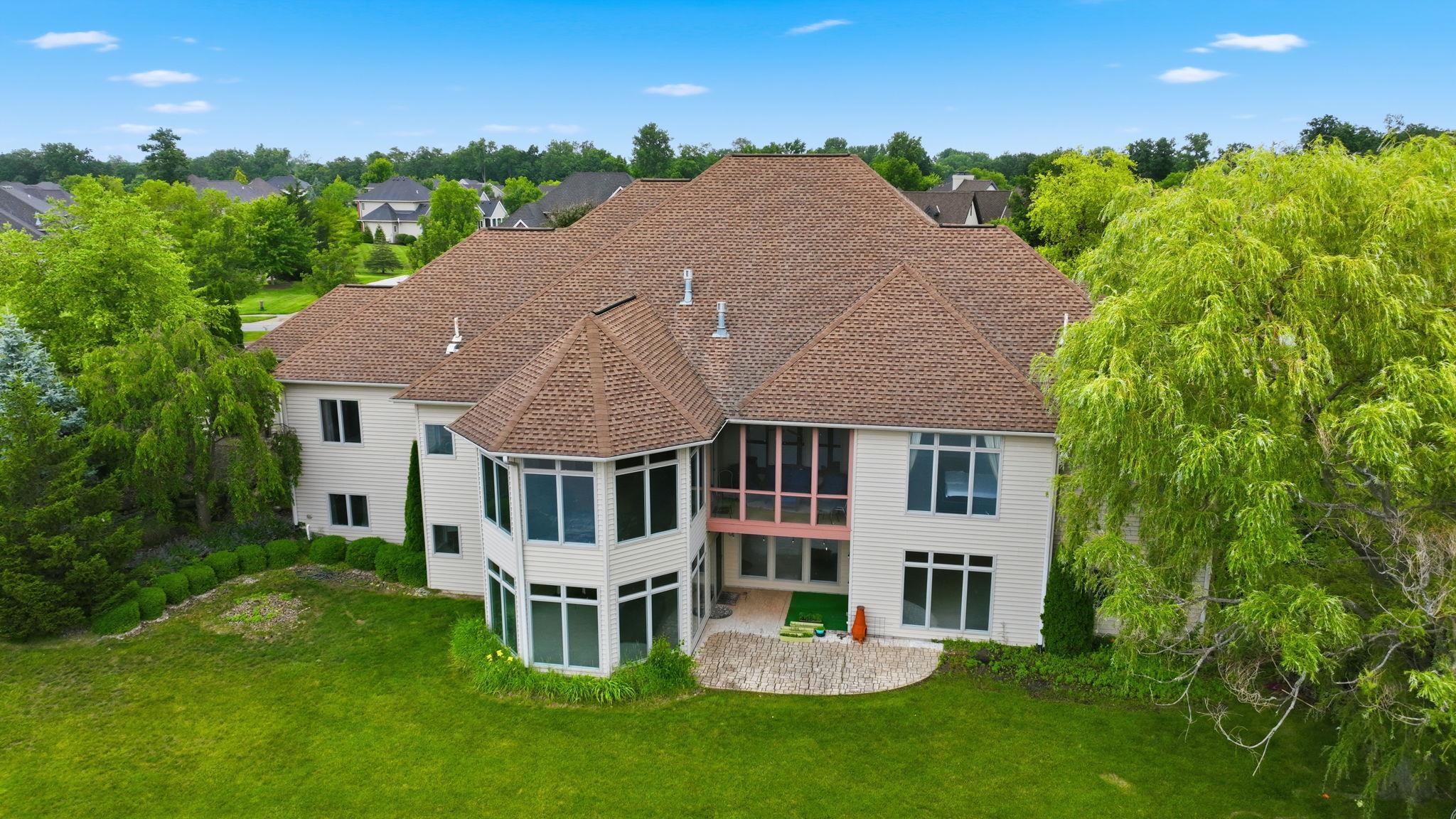 Rear exterior showcasing a multi-level design with abundant windows