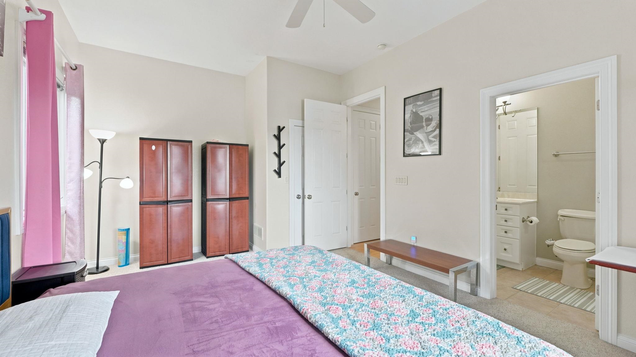 Bedroom featuring light-colored walls and carpet flooring