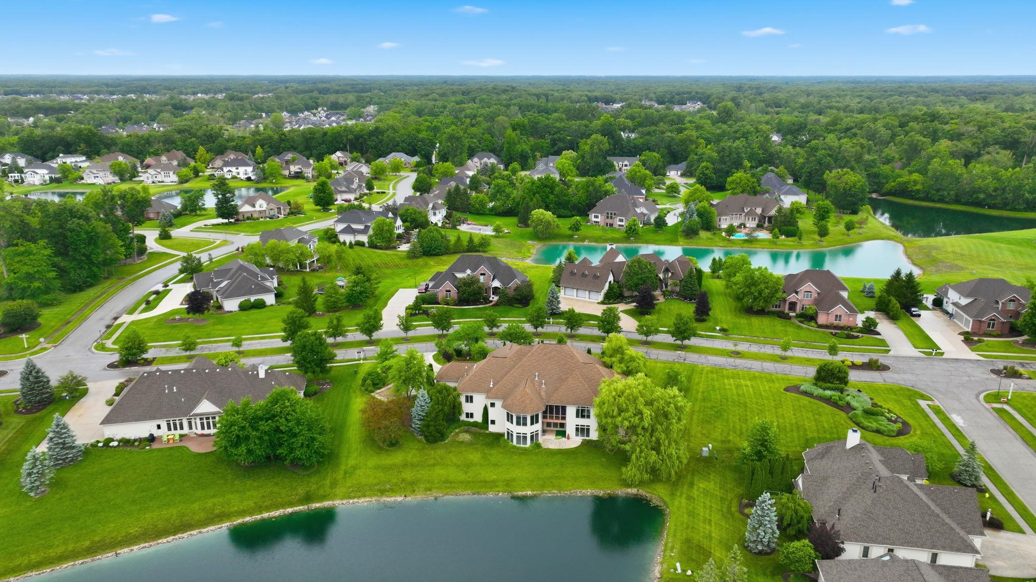Expansive residential community featuring multiple ponds, abundant mature trees, and a network of paved streets
