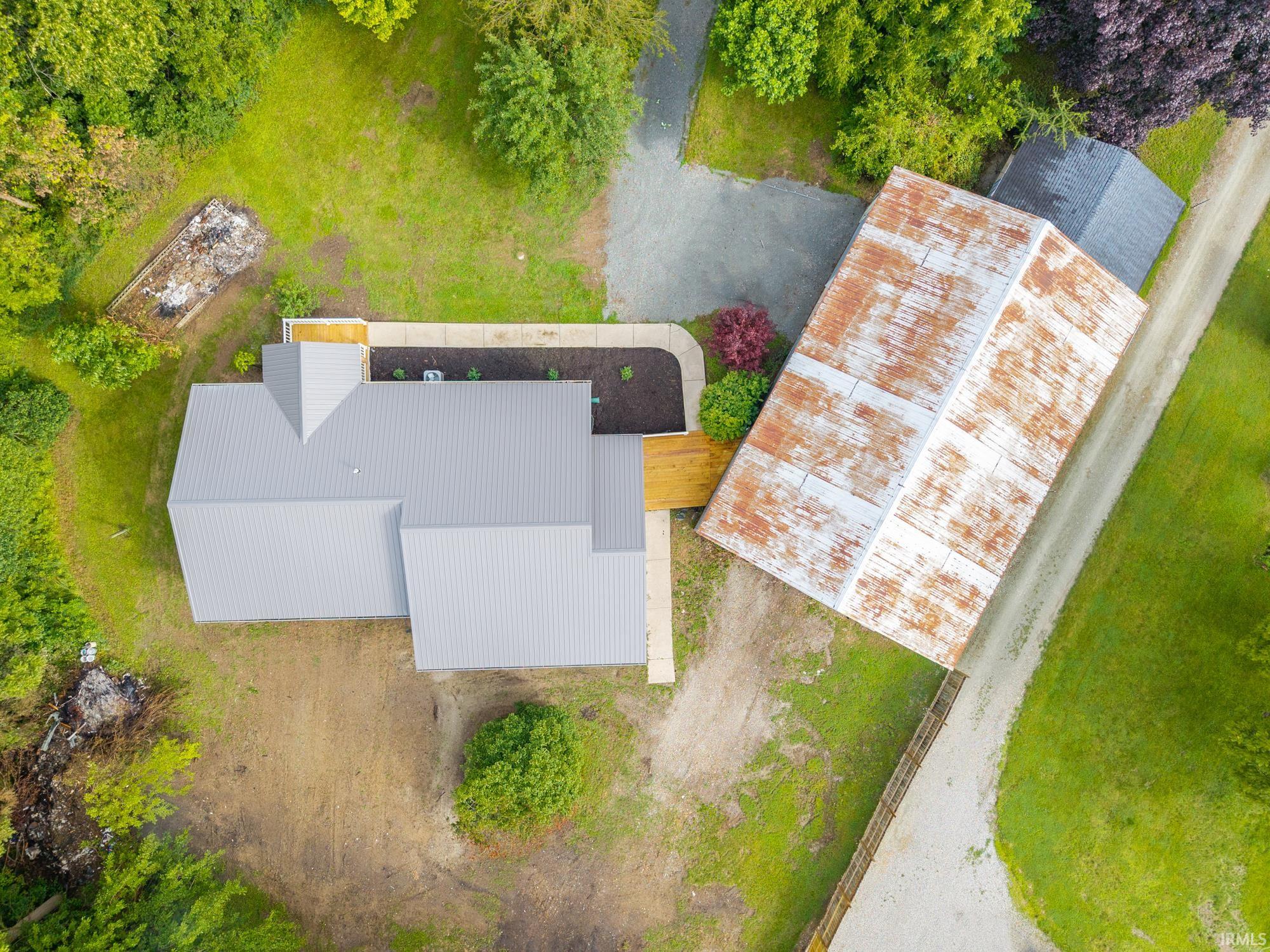 Modern metal-roofed structure featuring a light gray finish
