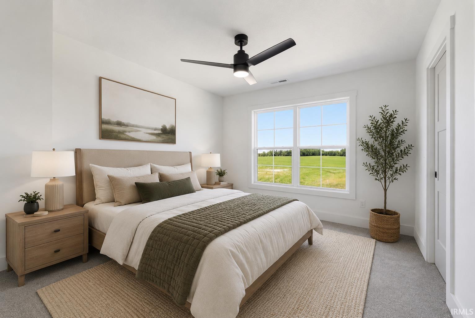 Bedroom featuring a large multi-pane window with bright exterior scenery, neutral carpeting, and a ceiling fan with integrated lighting