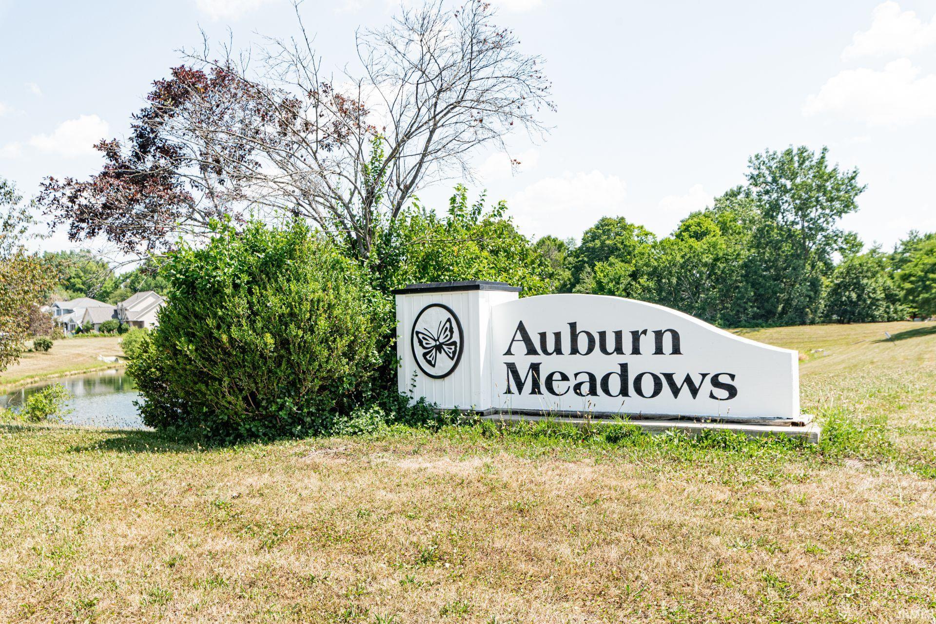 Auburn Meadows community signage featuring a butterfly emblem