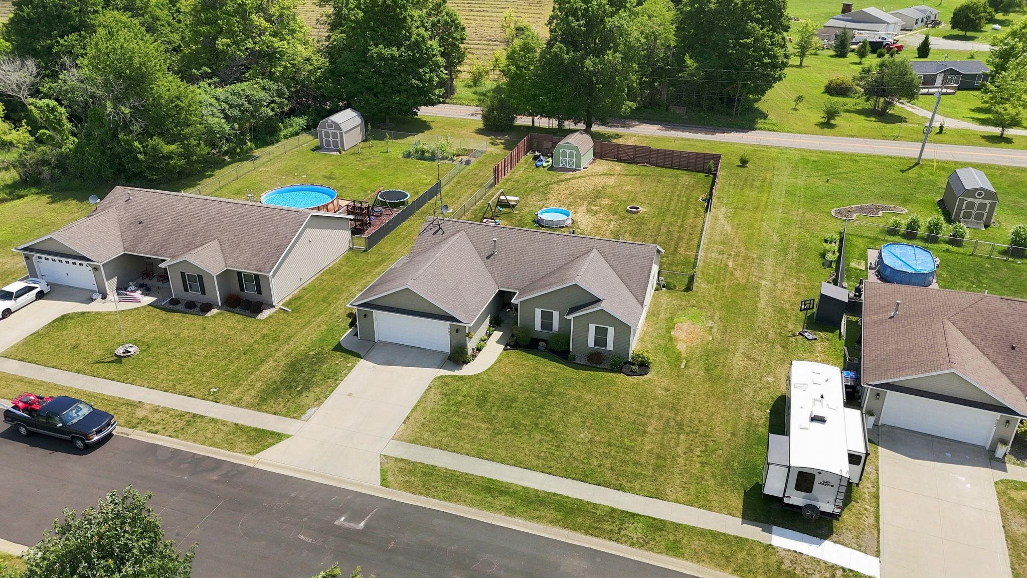 Single-story residence featuring a two-car garage and a paved driveway