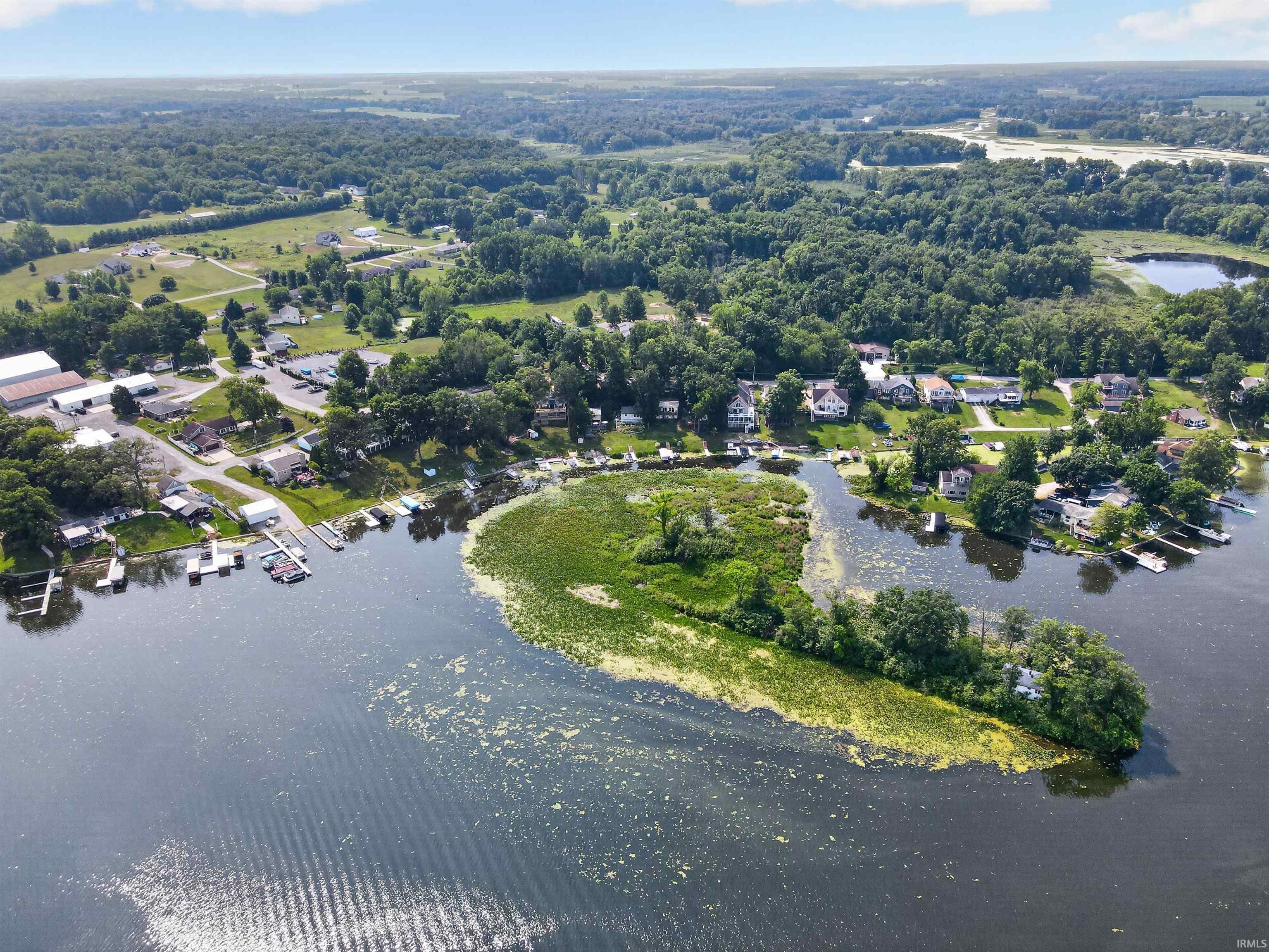 Aerial perspective showcasing waterfront properties with private docks