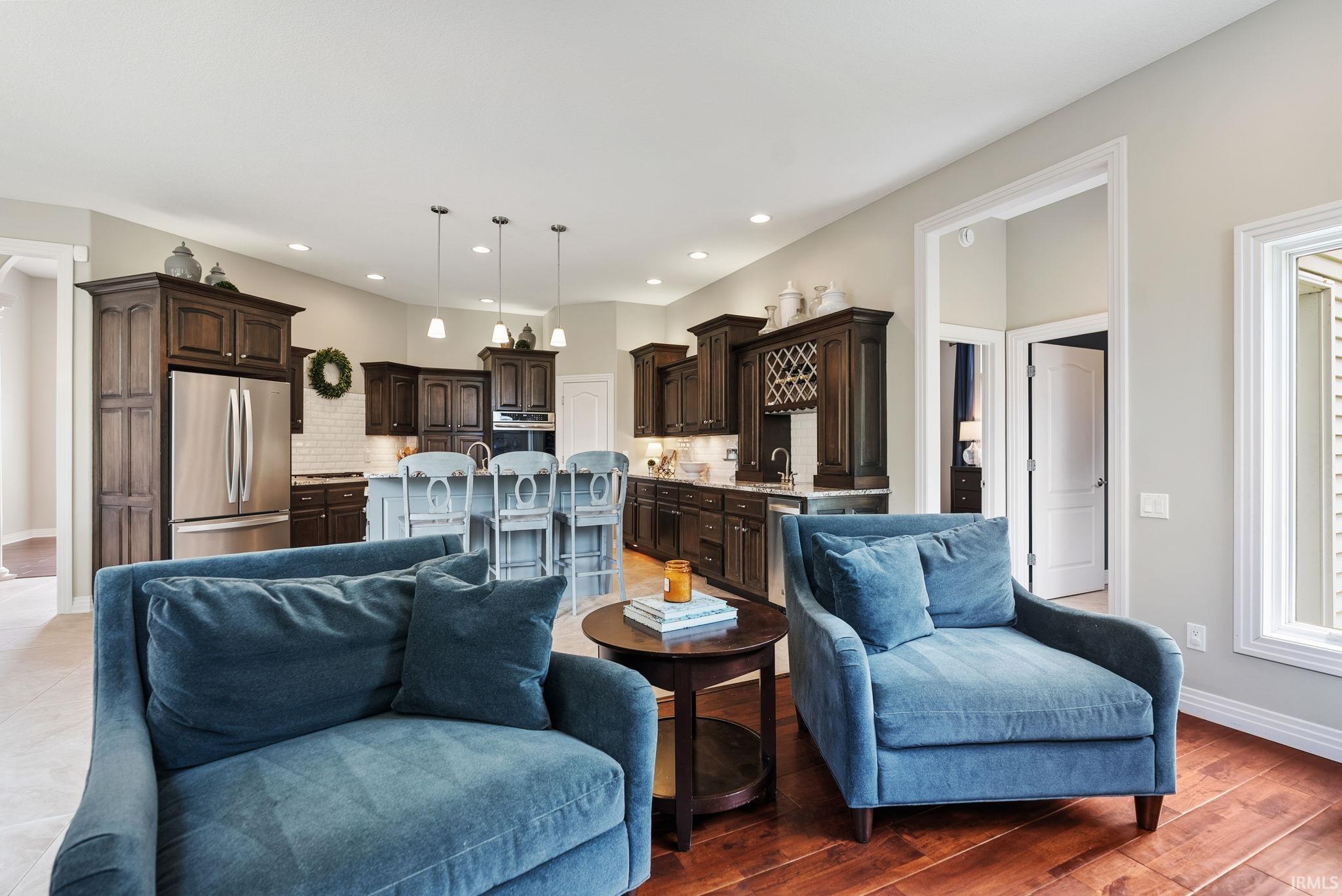 Open-concept living space featuring wood-finish flooring