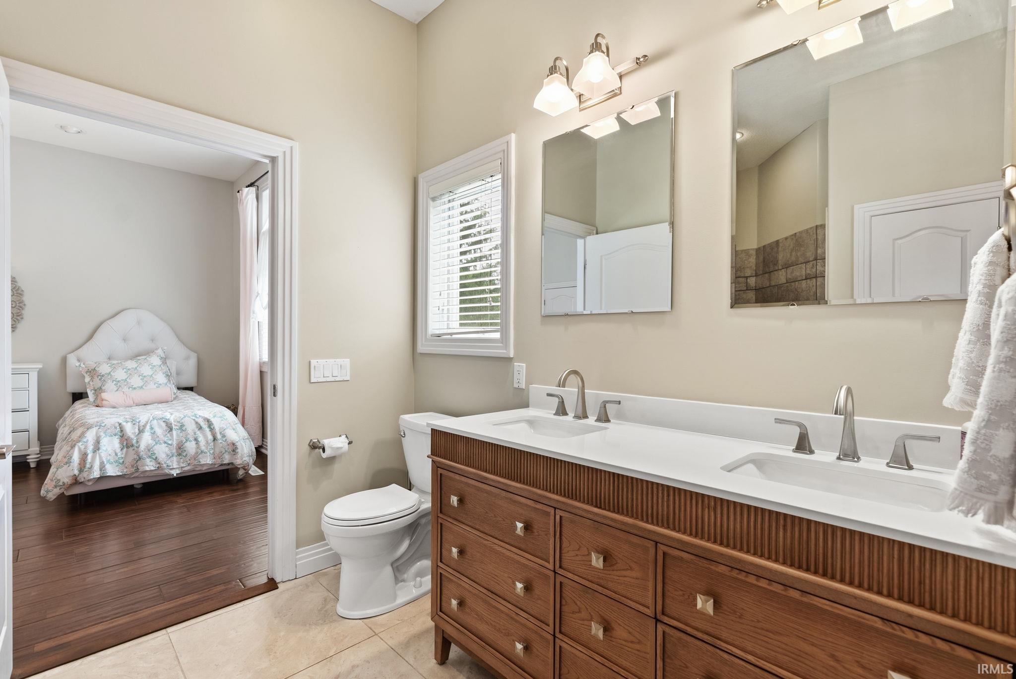 Double vanity with a white countertop and dual undermount sinks
