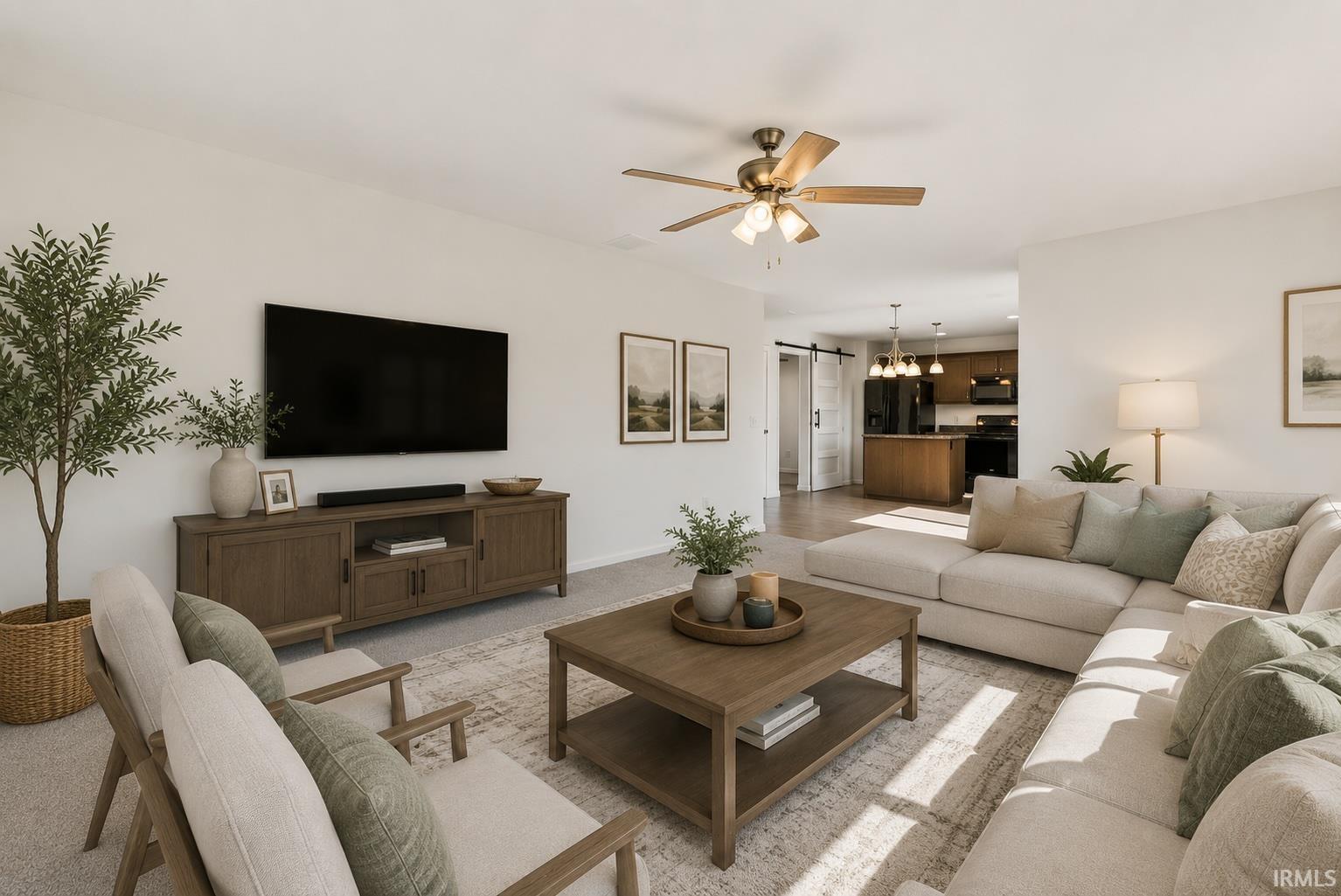 Open concept living space featuring neutral wall tones, recessed lighting, and a ceiling fan