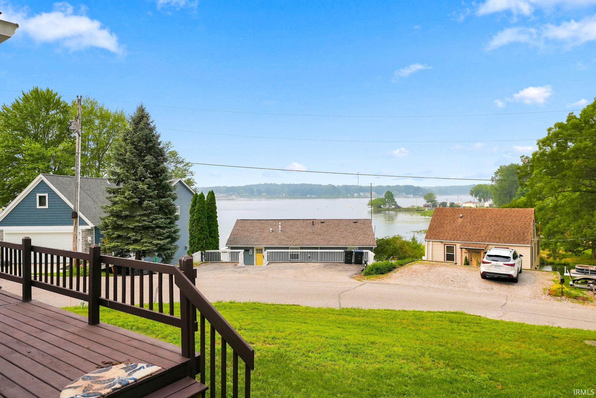 Expansive outdoor deck with dark wood-finish railing