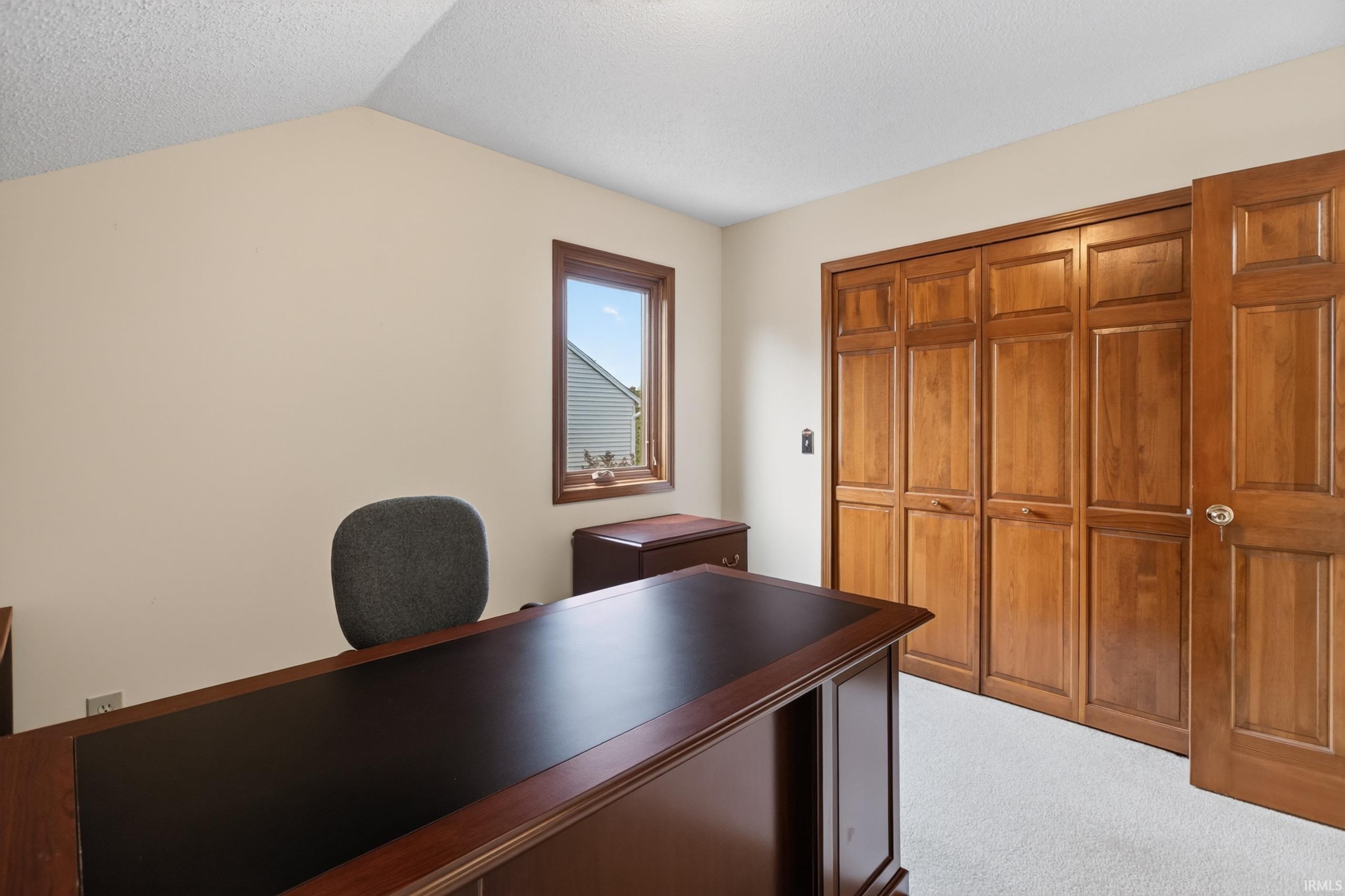 Neutral-toned walls complement light-colored carpeting