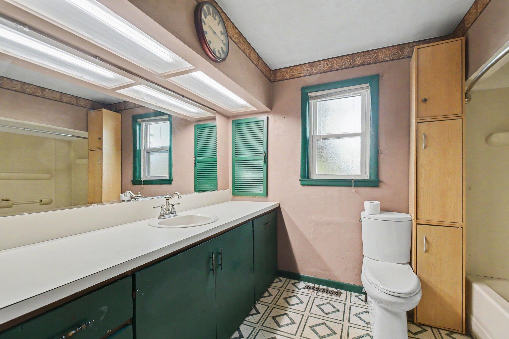 Extended vanity with an integrated basin and a chrome faucet
