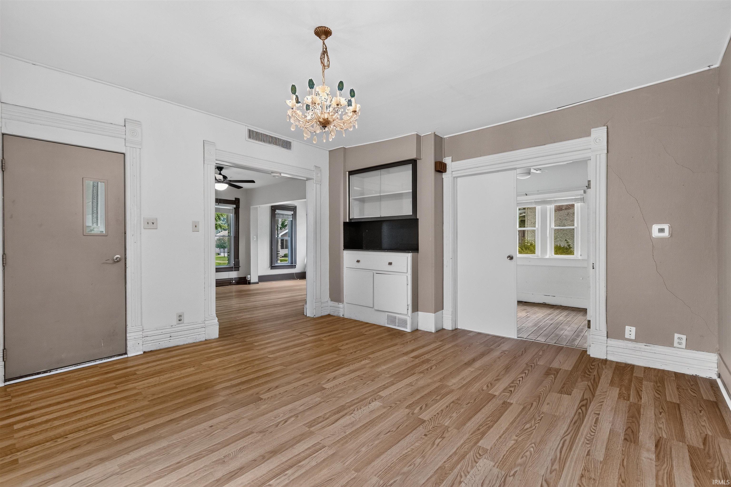 Open concept dining area with wood-finish flooring