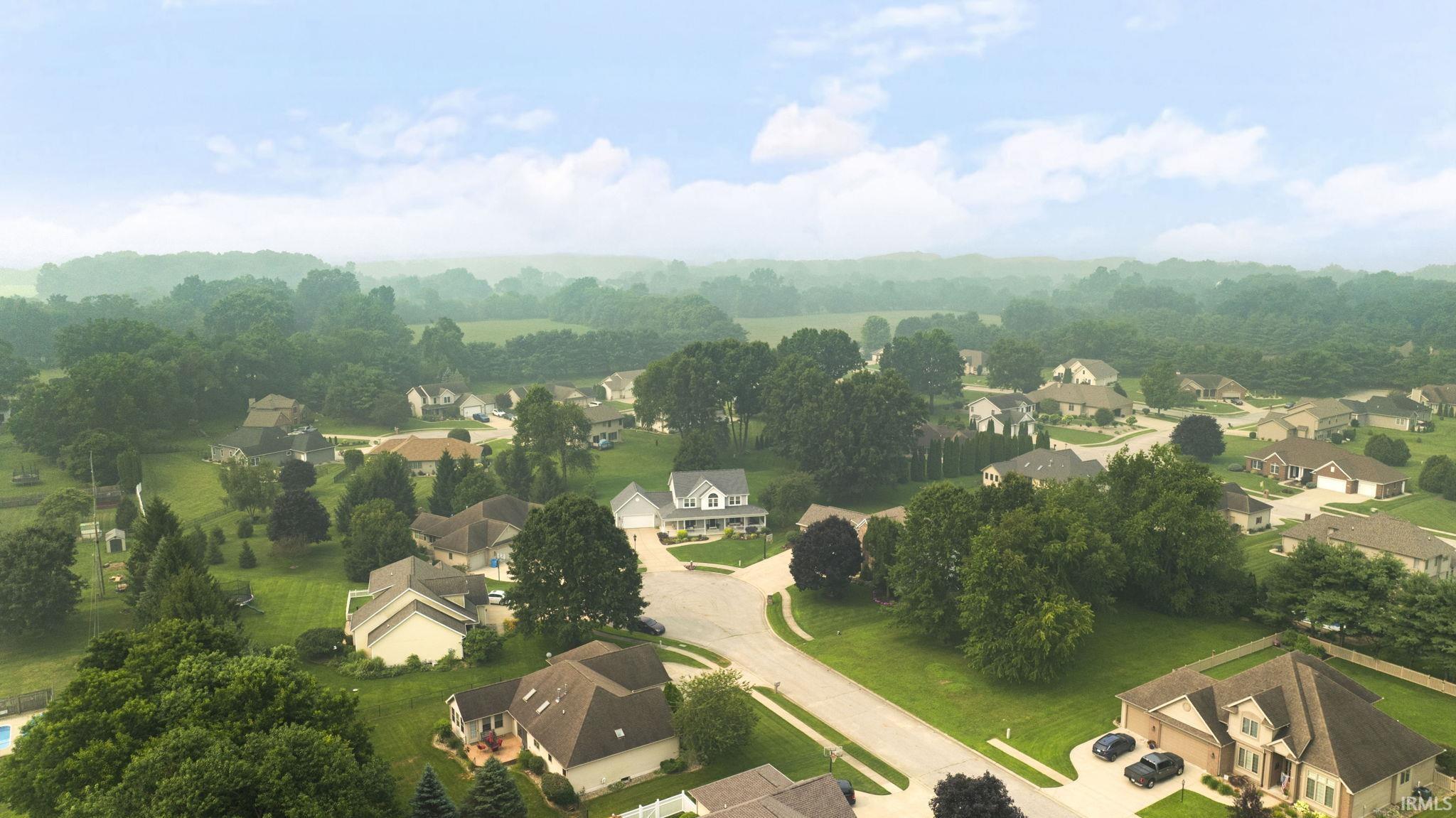 Suburban neighborhood featuring varied architectural styles and mature trees