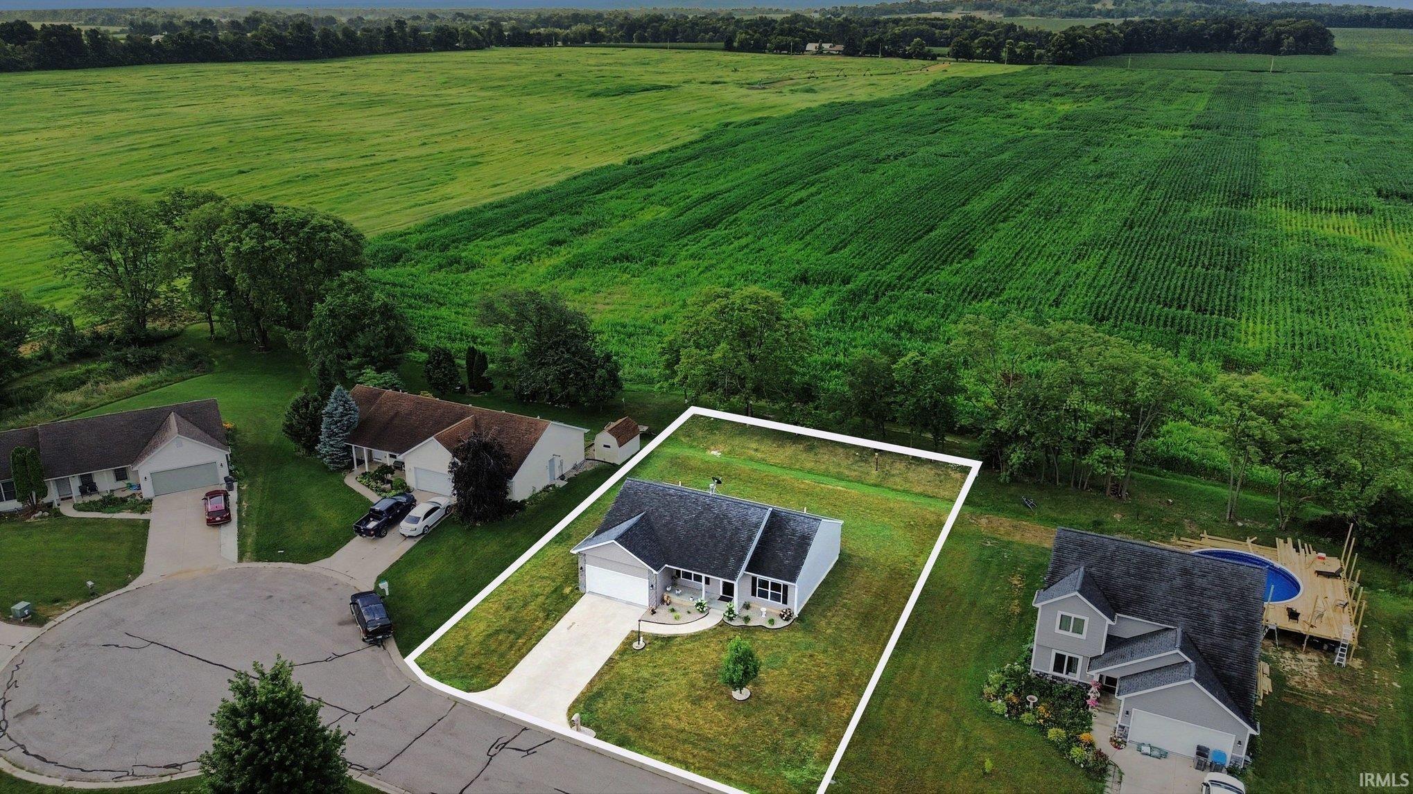 Single-story residence with an attached garage and a paved driveway