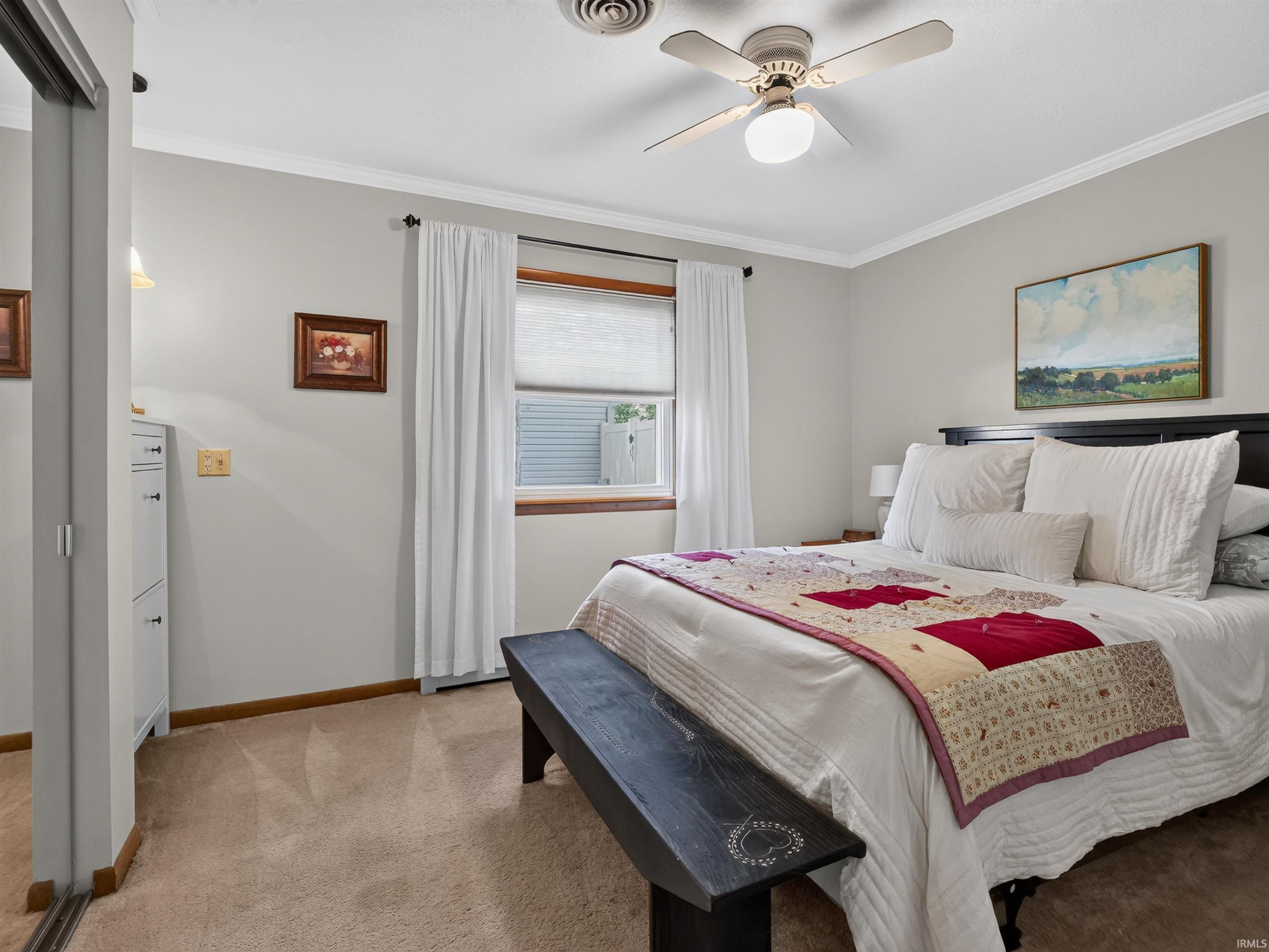 Bedroom featuring neutral wall color, and carpeted flooring