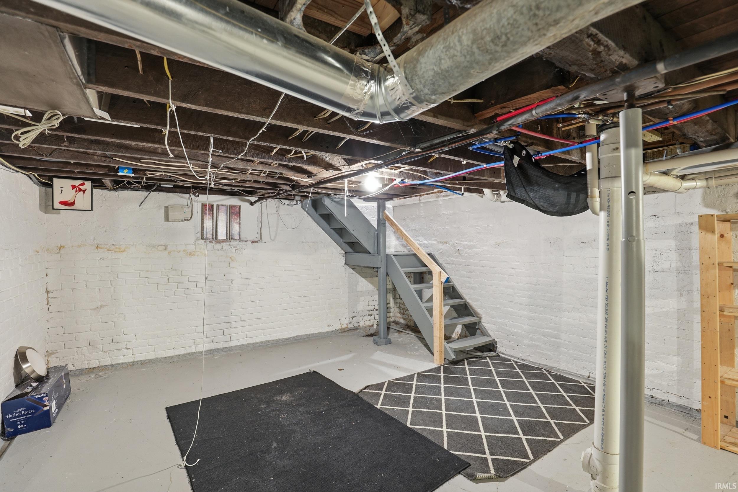 Unfinished basement with stairway