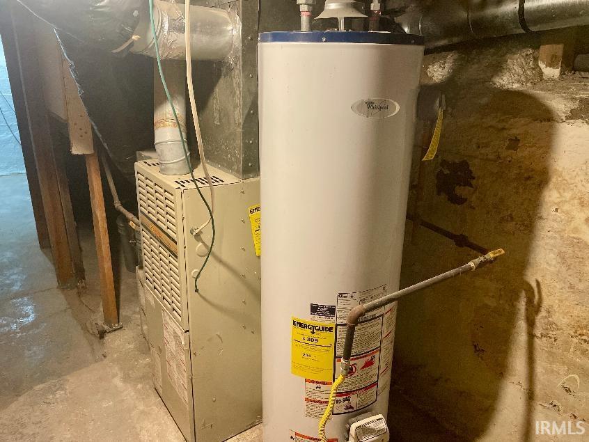 Water heater and furnace units with associated ductwork and piping