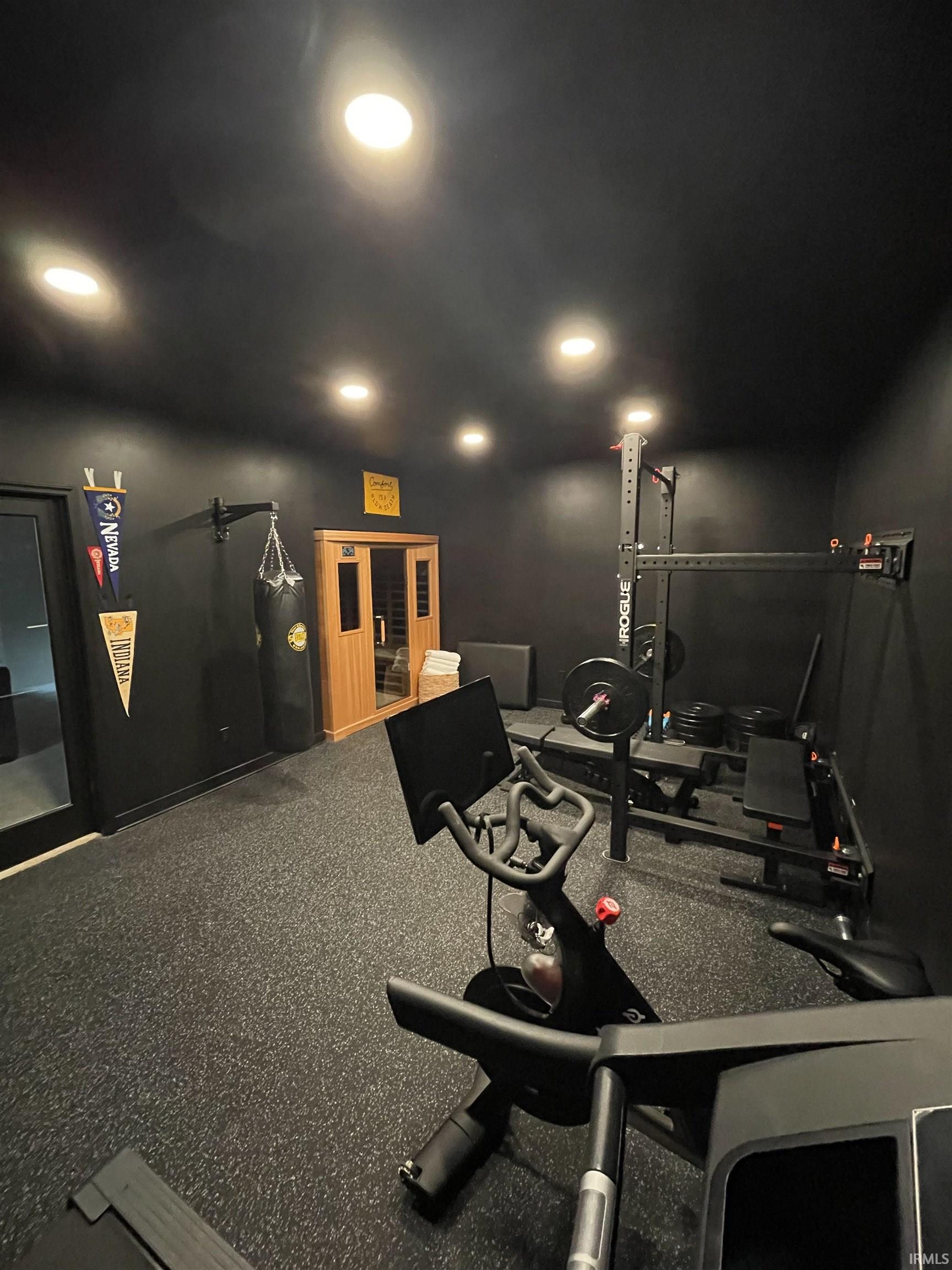 Dedicated fitness room featuring recessed lighting and rubberized flooring