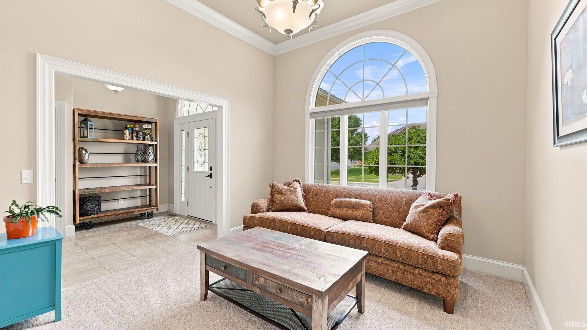 Arched window with decorative grilles and transom above