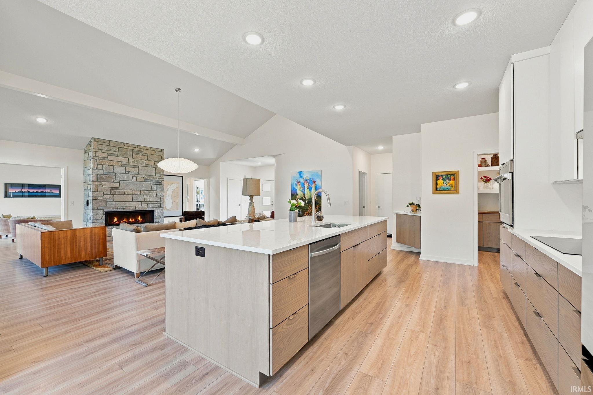 Spacious kitchen island with a built-in sink and stainless steel dishwasher